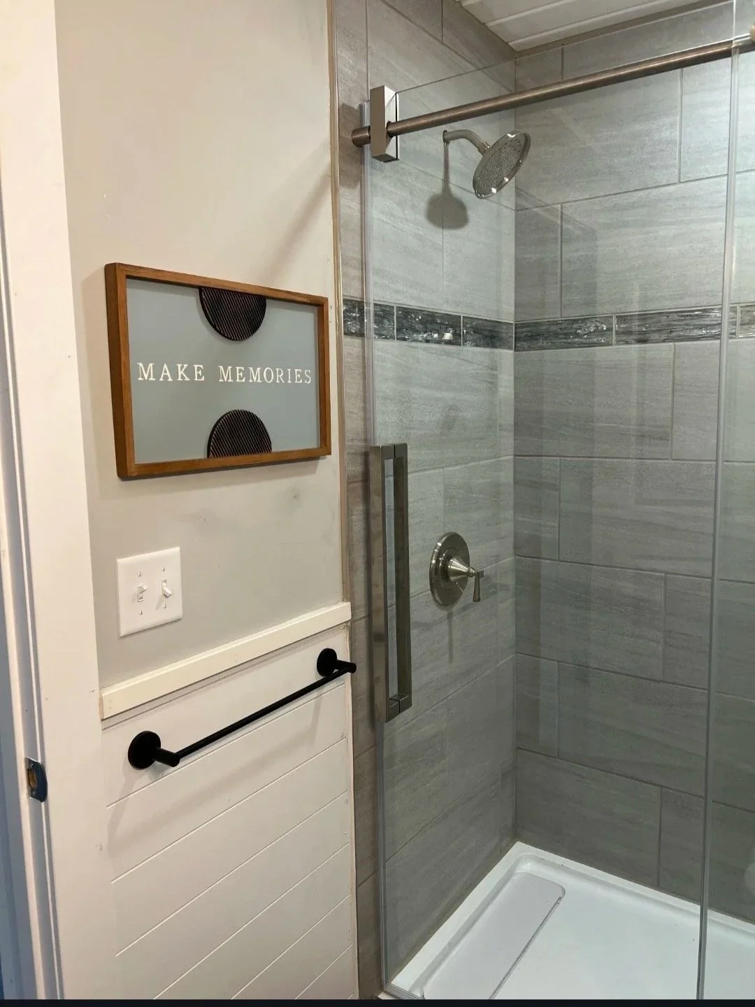 Tile shower with glass enclosure in Forest Lake MN home renovation