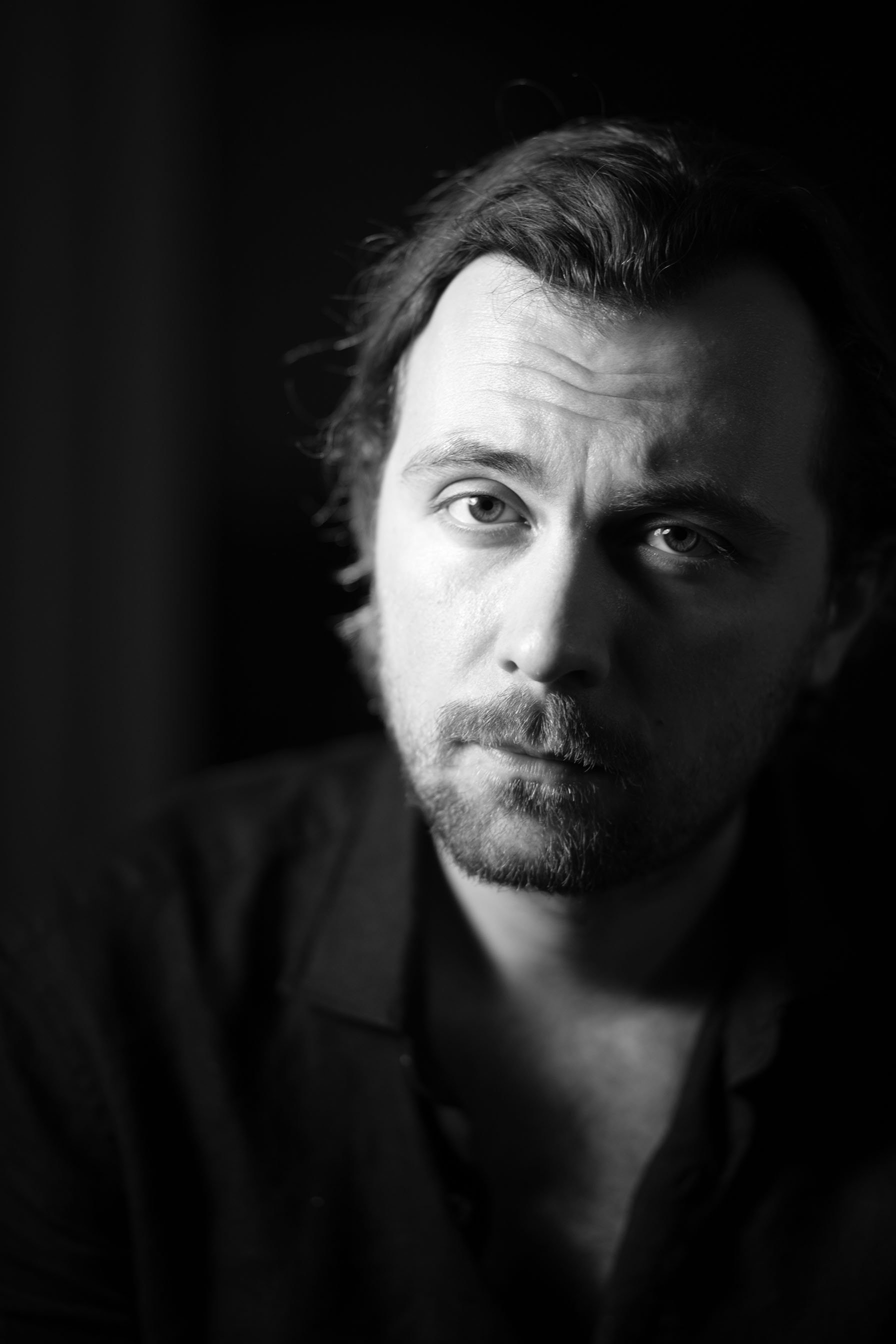 Headshot of Nathan Tosoni, film director and screenwriter