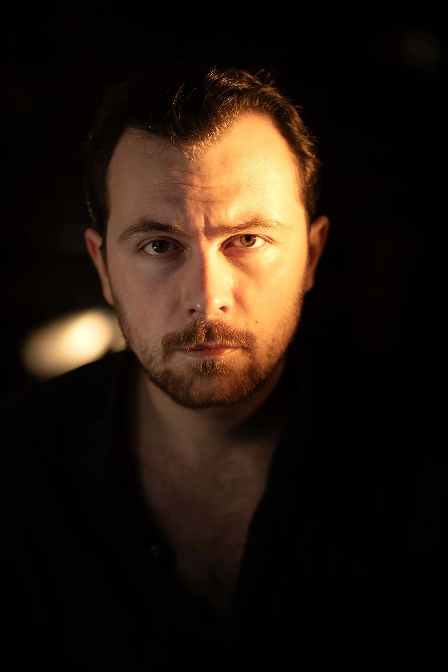Headshot of Nathan Tosoni, film director and screenwriter