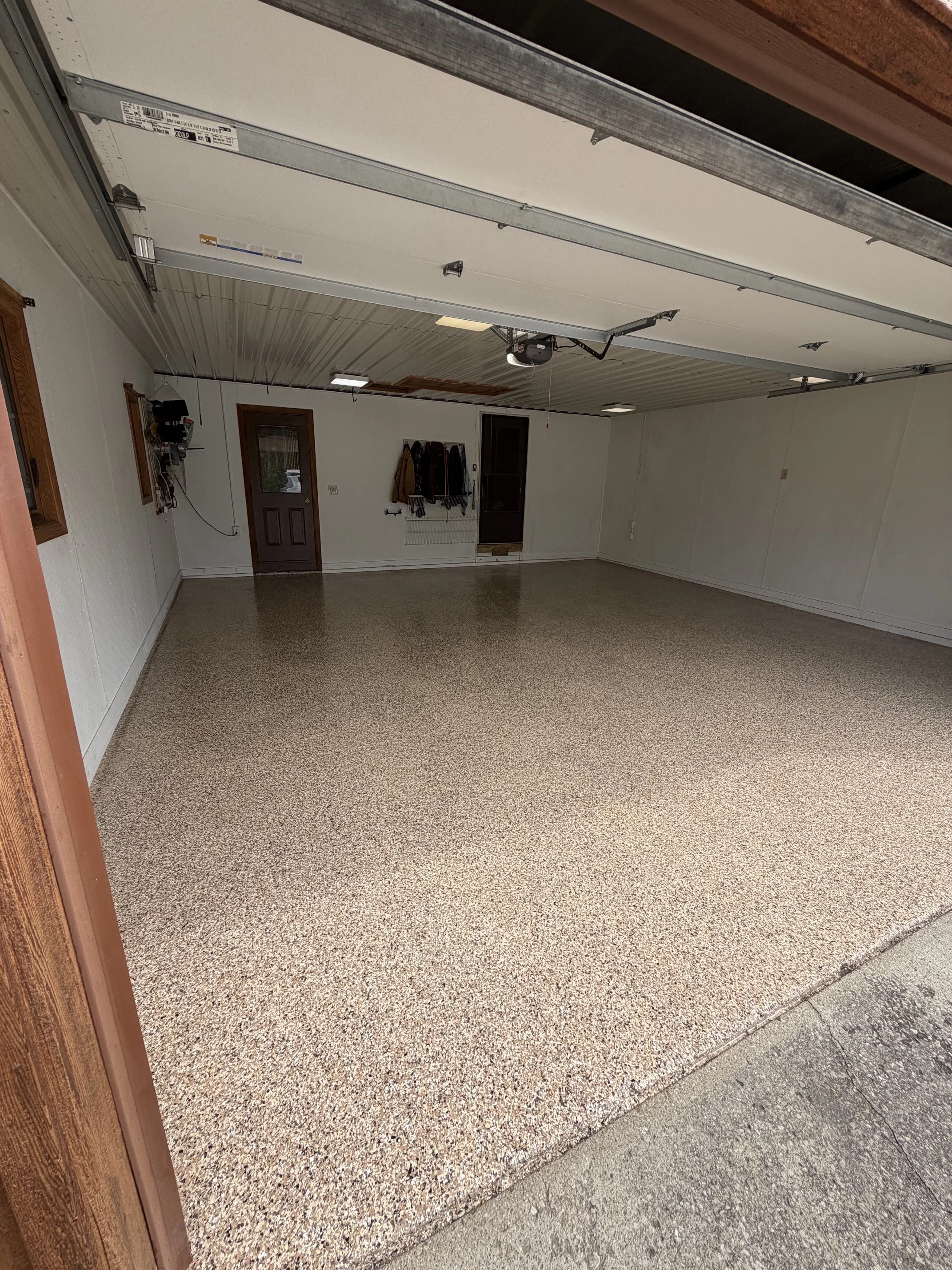 Residential Pitted Epoxy Flake Floor After 