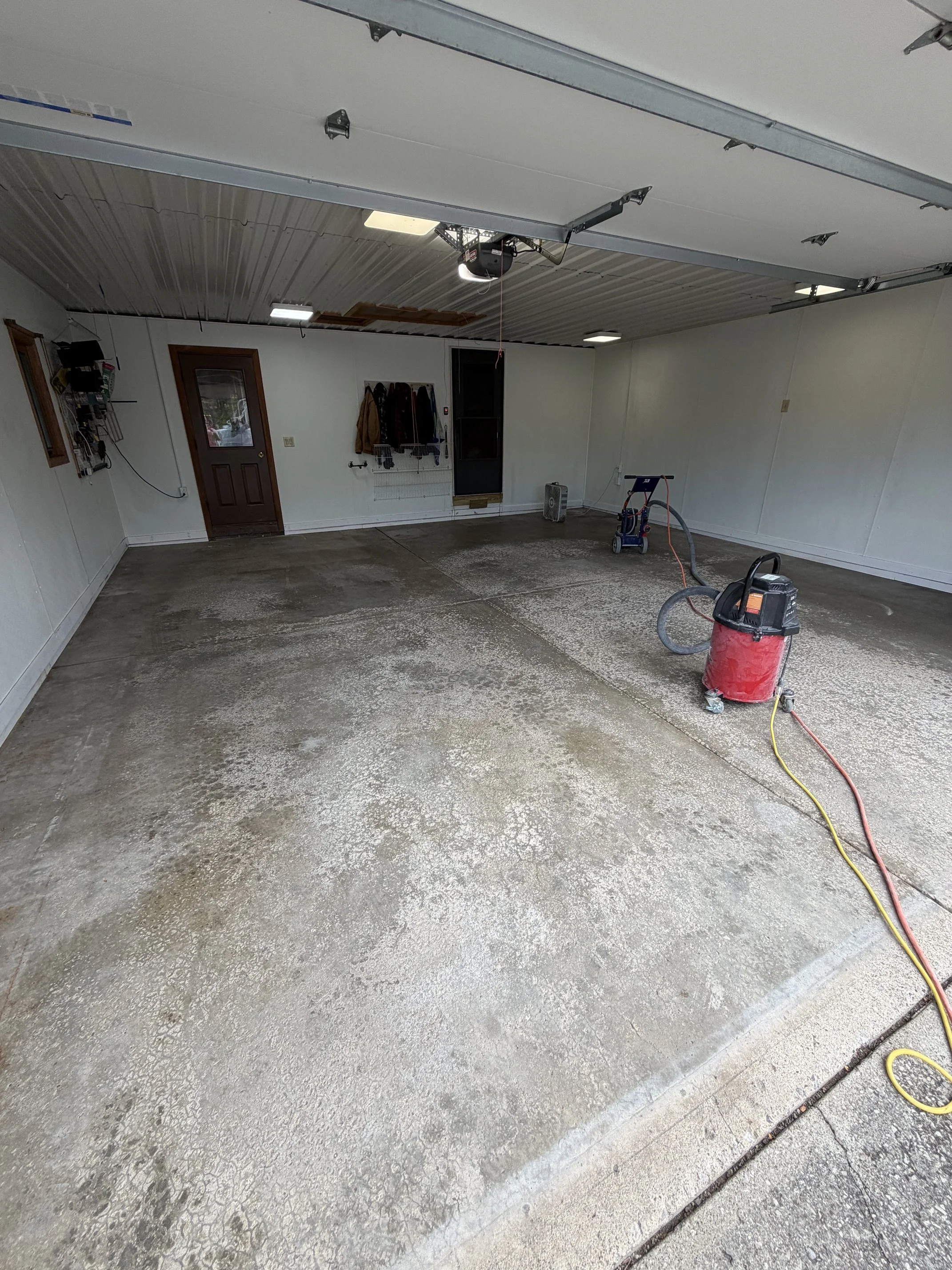 Residential Pitted Epoxy Flake Floor Before