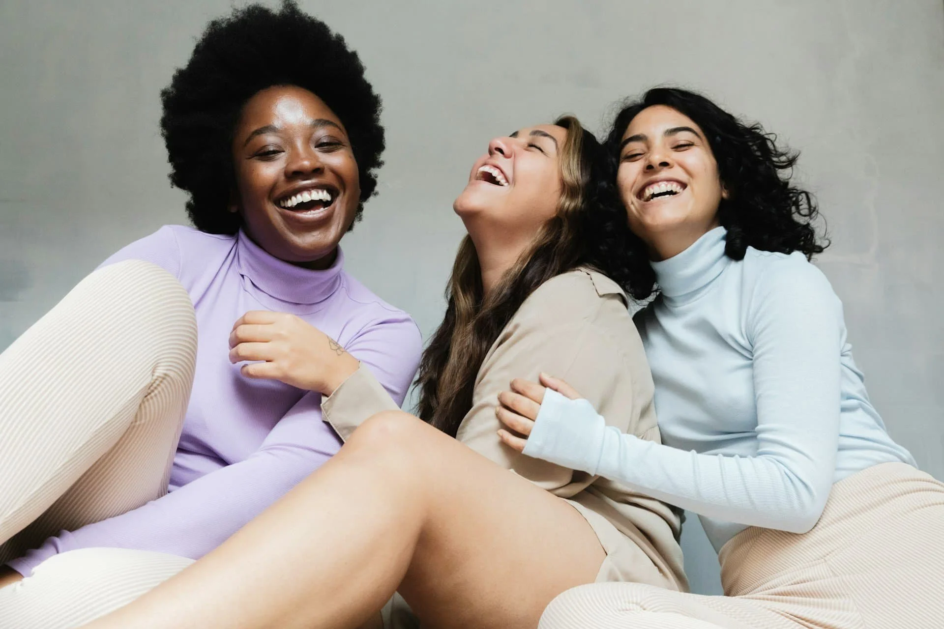 Joyful community of women at an empowering therapy practice