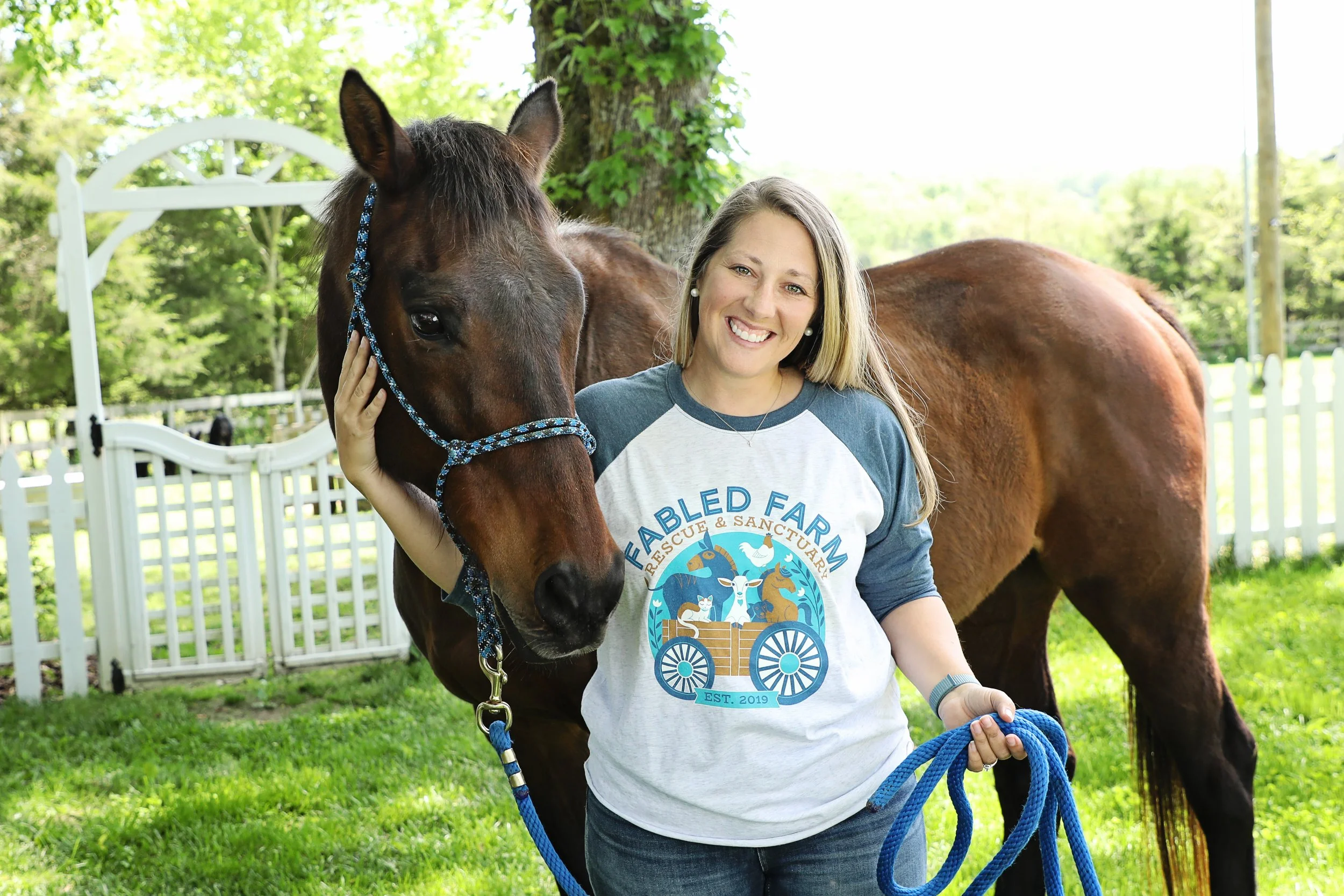 Volunteer in Fabled Farm Shirt with Senior Horse