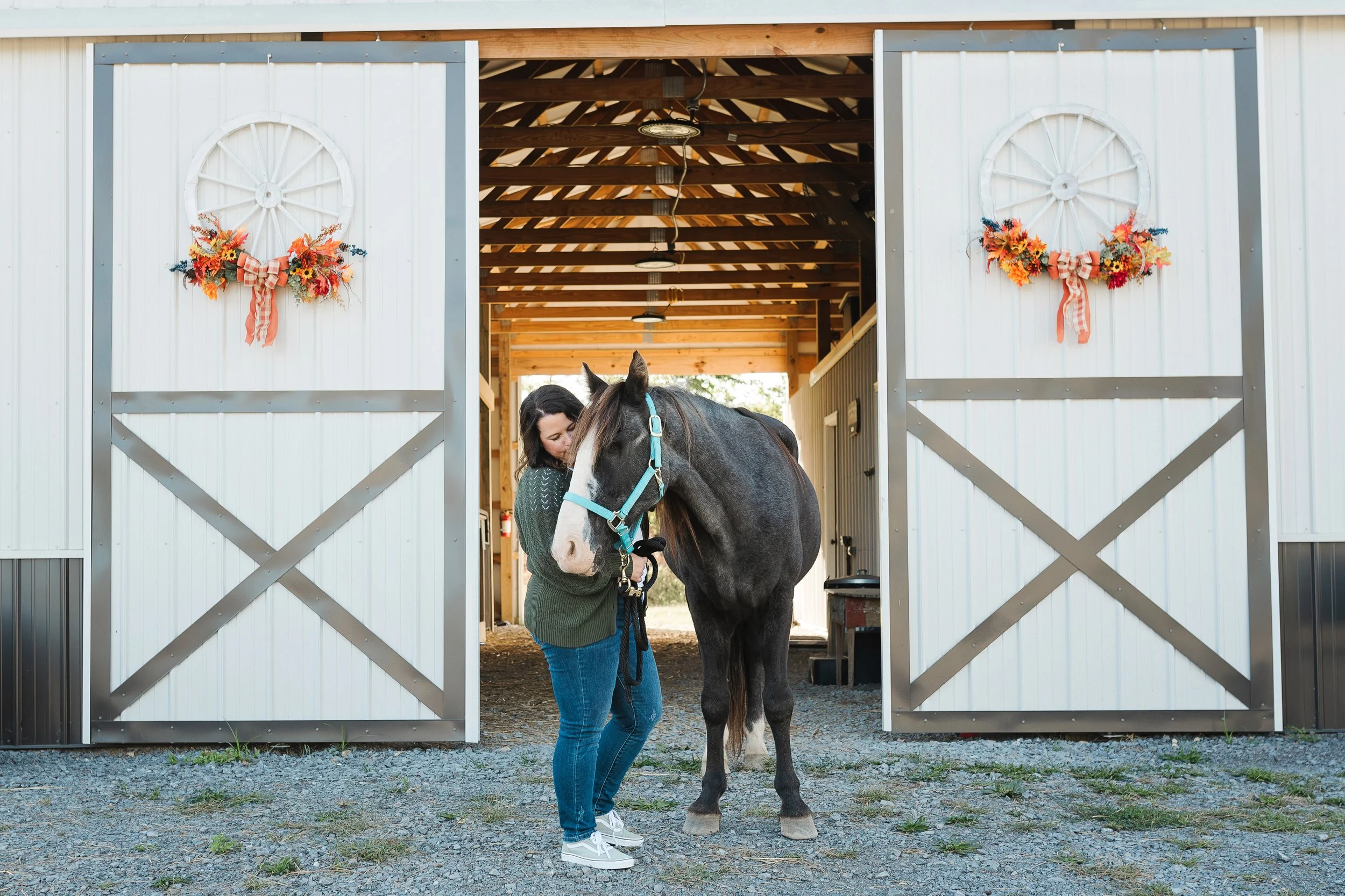 April with Ritz in front of white barn