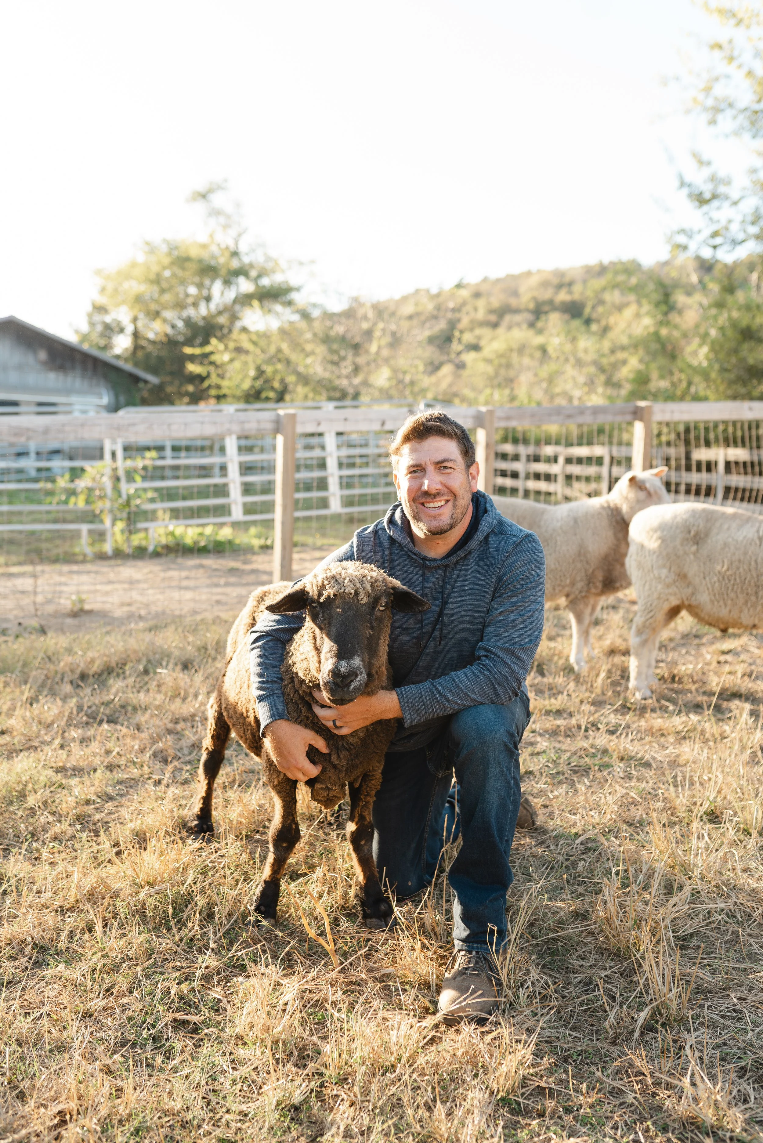 Bryan with rescued sheep at Fabled Farm Rescue