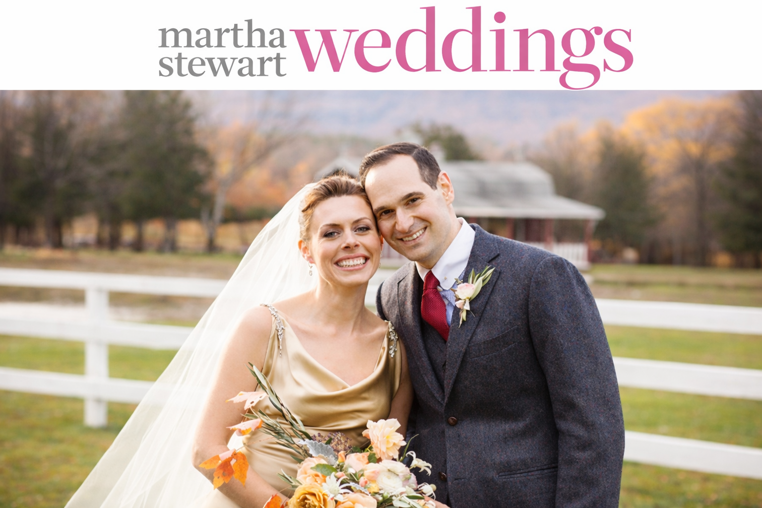 A bouquet of white, yellow, and peach flowers with green and orange leaves, wrapped with white ribbon, placed on a dark surface.