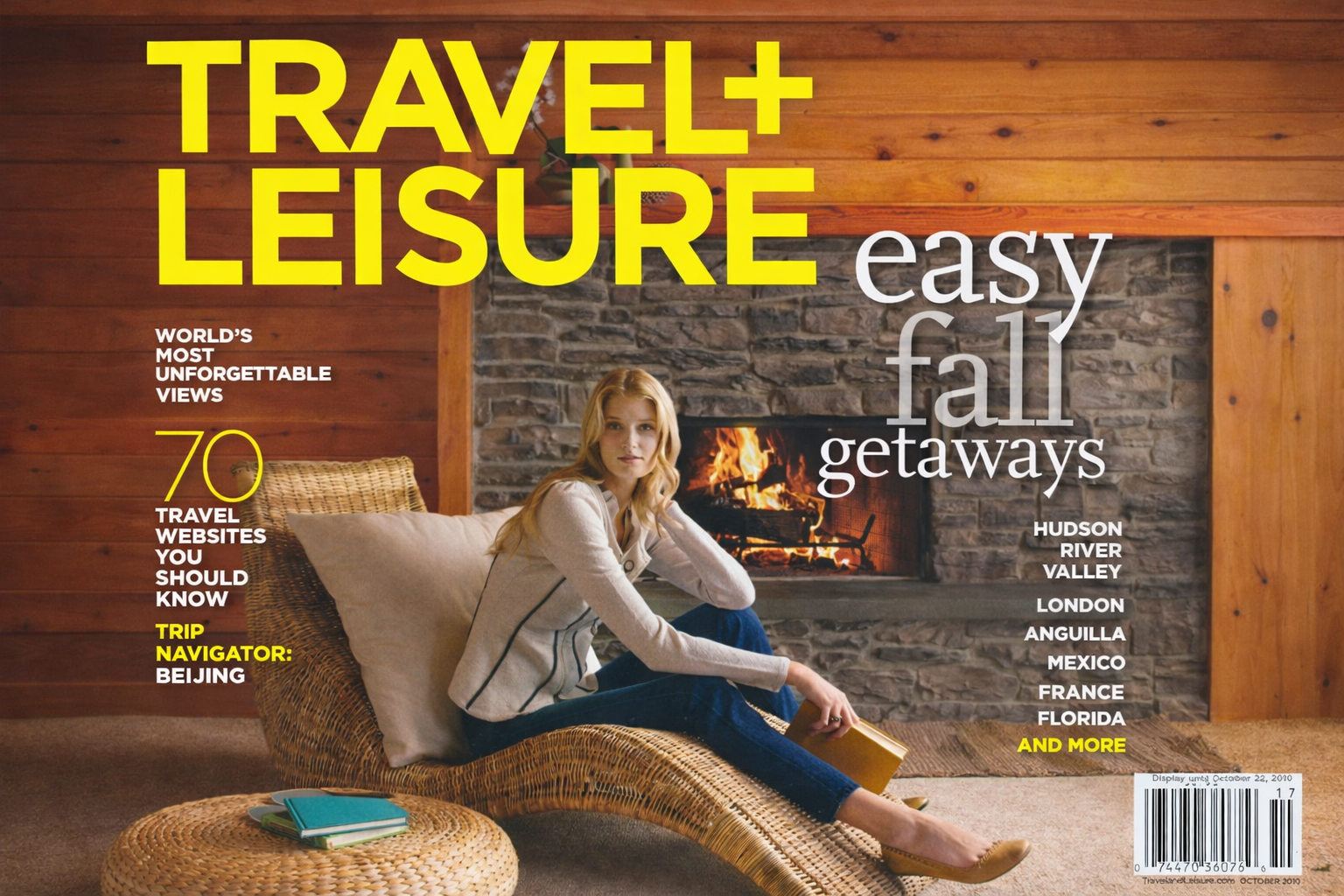 Magazine cover featuring the title 'Travel + Leisure' in large yellow text, with additional smaller text 'easy fall' and a smaller headline 'World's Most Unforgettable Views', and a partial image of a person with blonde hair.