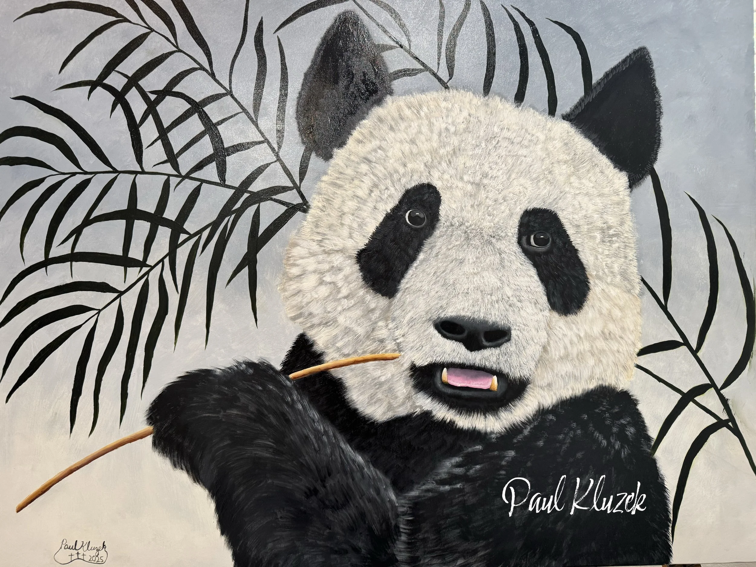 Painting of a panda holding a bamboo stalk with leaves in the background, signed by Paul Kluzek in 2023.