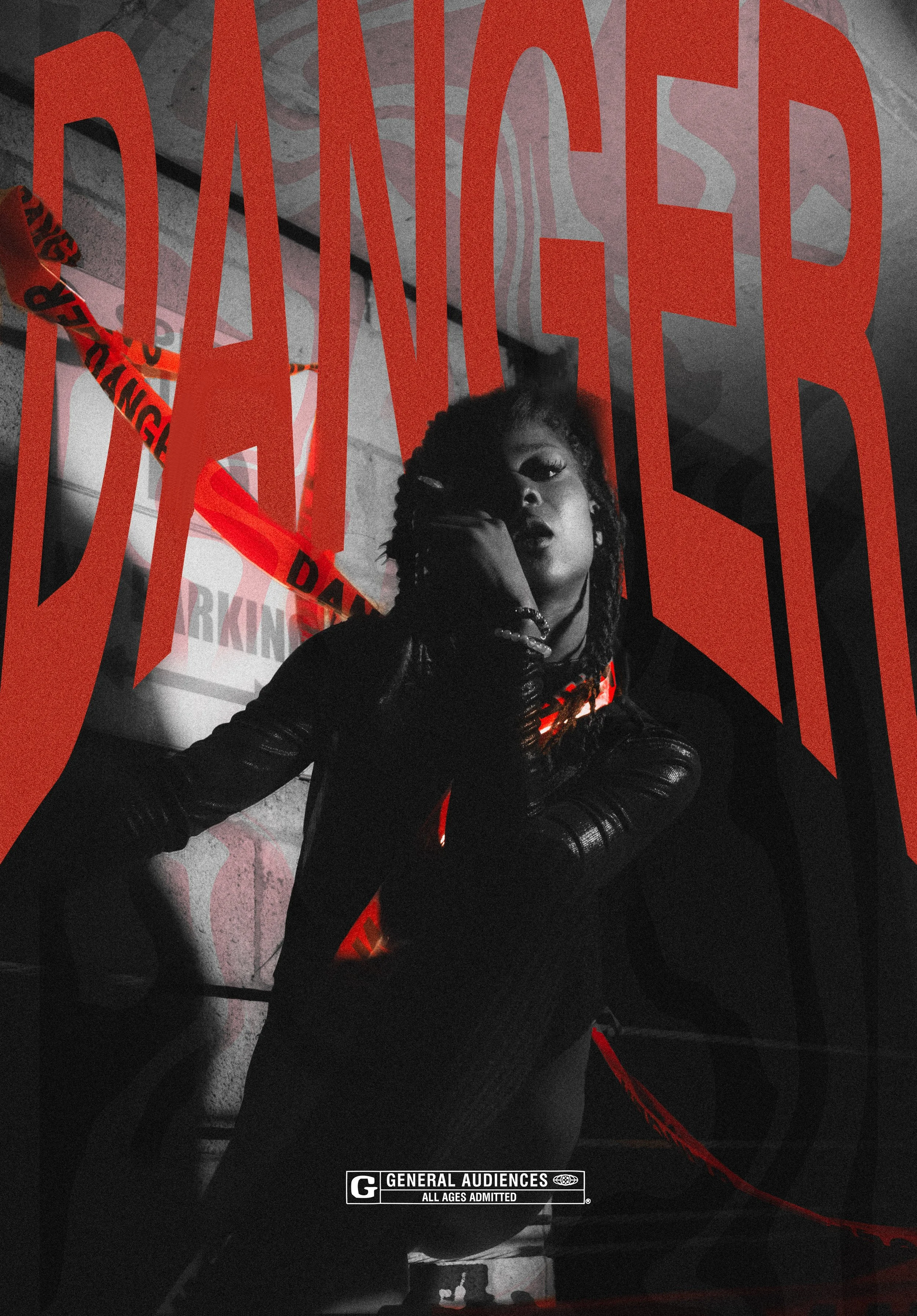 A woman with dreadlocks wearing black gloves and a black outfit is sitting against a wall with a large red 'DANGER' sign and caution tape. The scene has a dark, moody atmosphere, with some elements of red and black in the lighting.