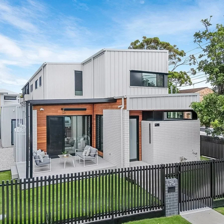Townhouse in Newcastle, white colorbond cladding and blackbutt timber highlights