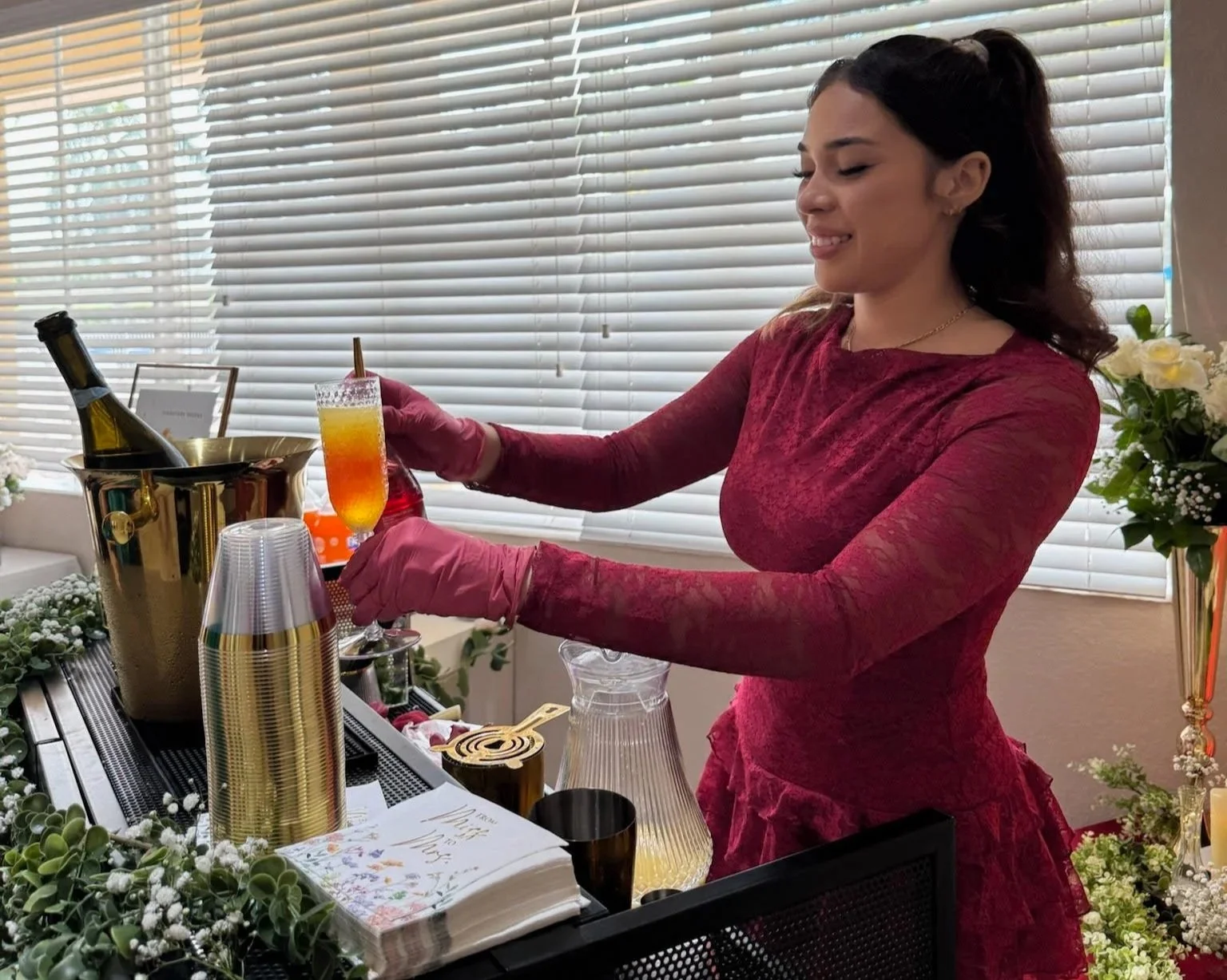 Pouring Sunrise Mimosa for a Mobile Bartending Company.