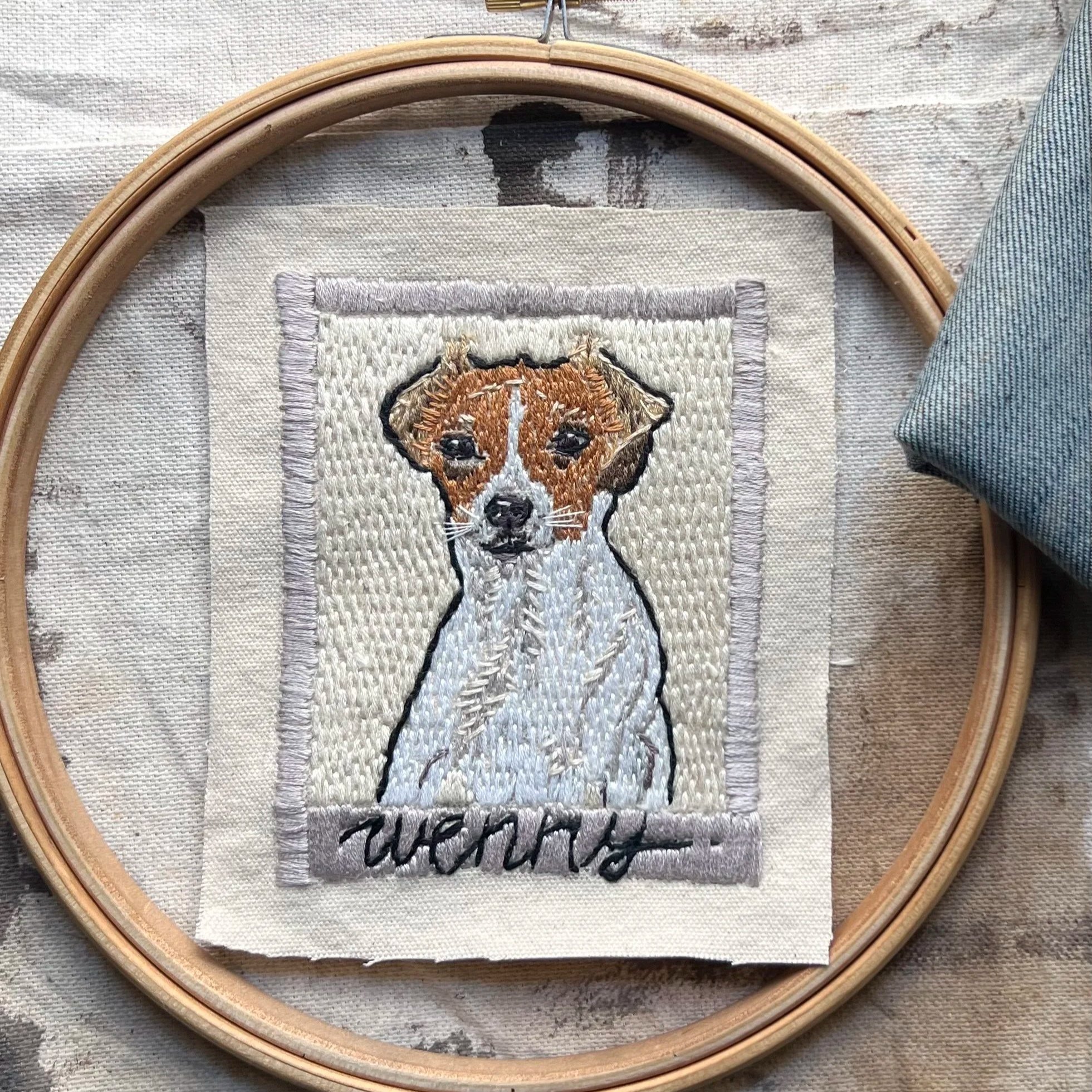 small jack Russell embroidered by hand as a custom pet portrait of this gorgeous dog. Set in a polaroid-style stitched frame, this portrait is love, and dog, and happiness.