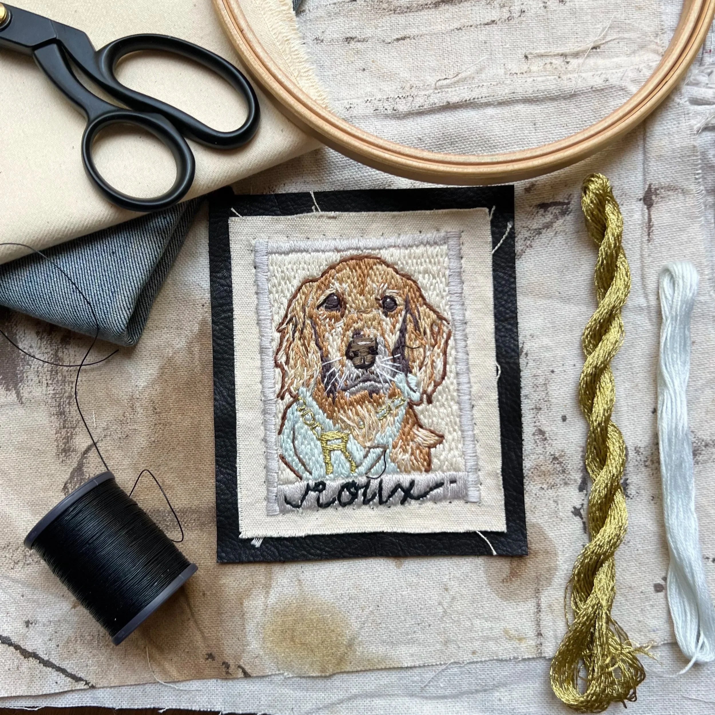 A golden retriever hand stitched in this modern pet portrait.
