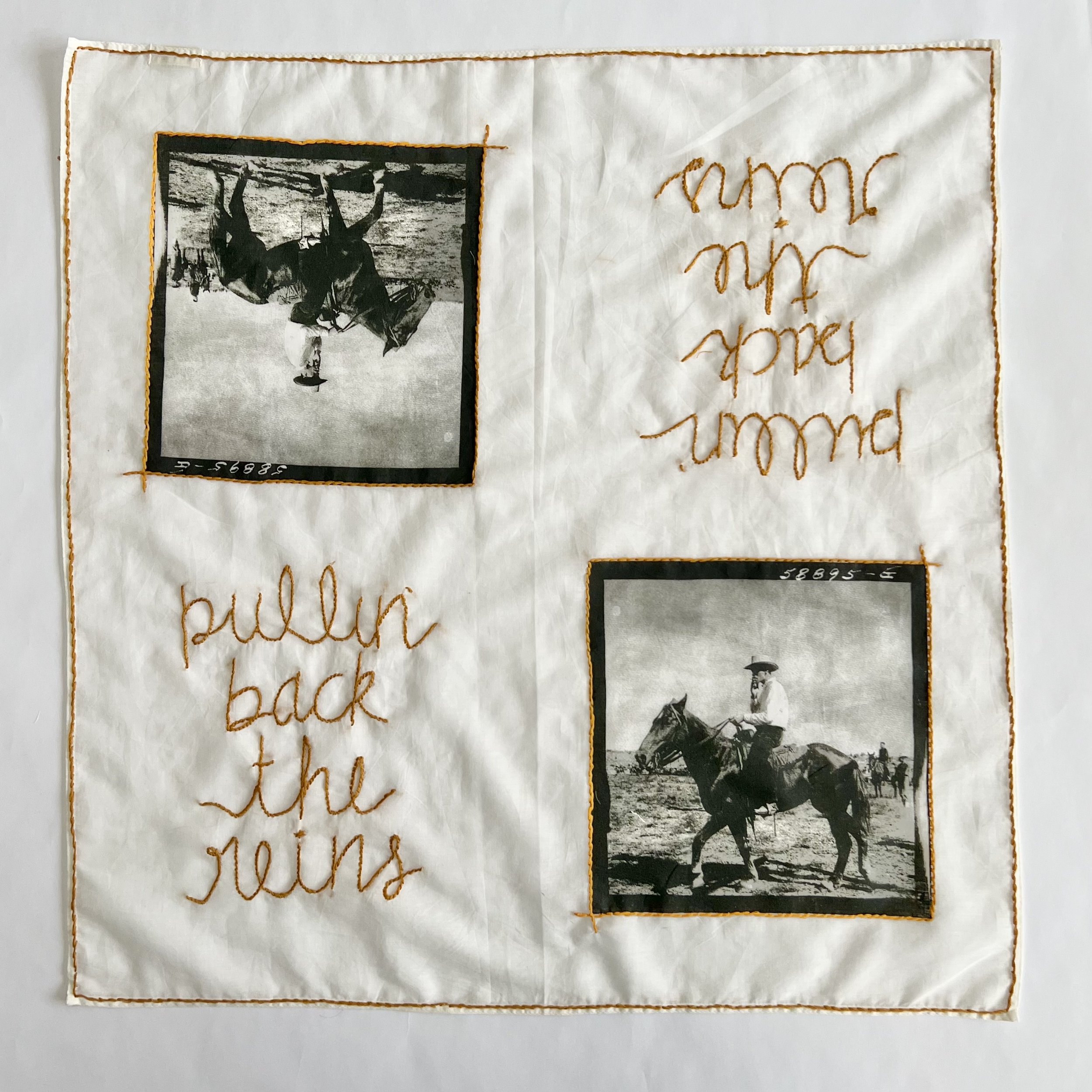 A quilt with two black and white photographs of cowboys on horseback and orange embroidered text reading "pullin back the reins" and "pound and you".