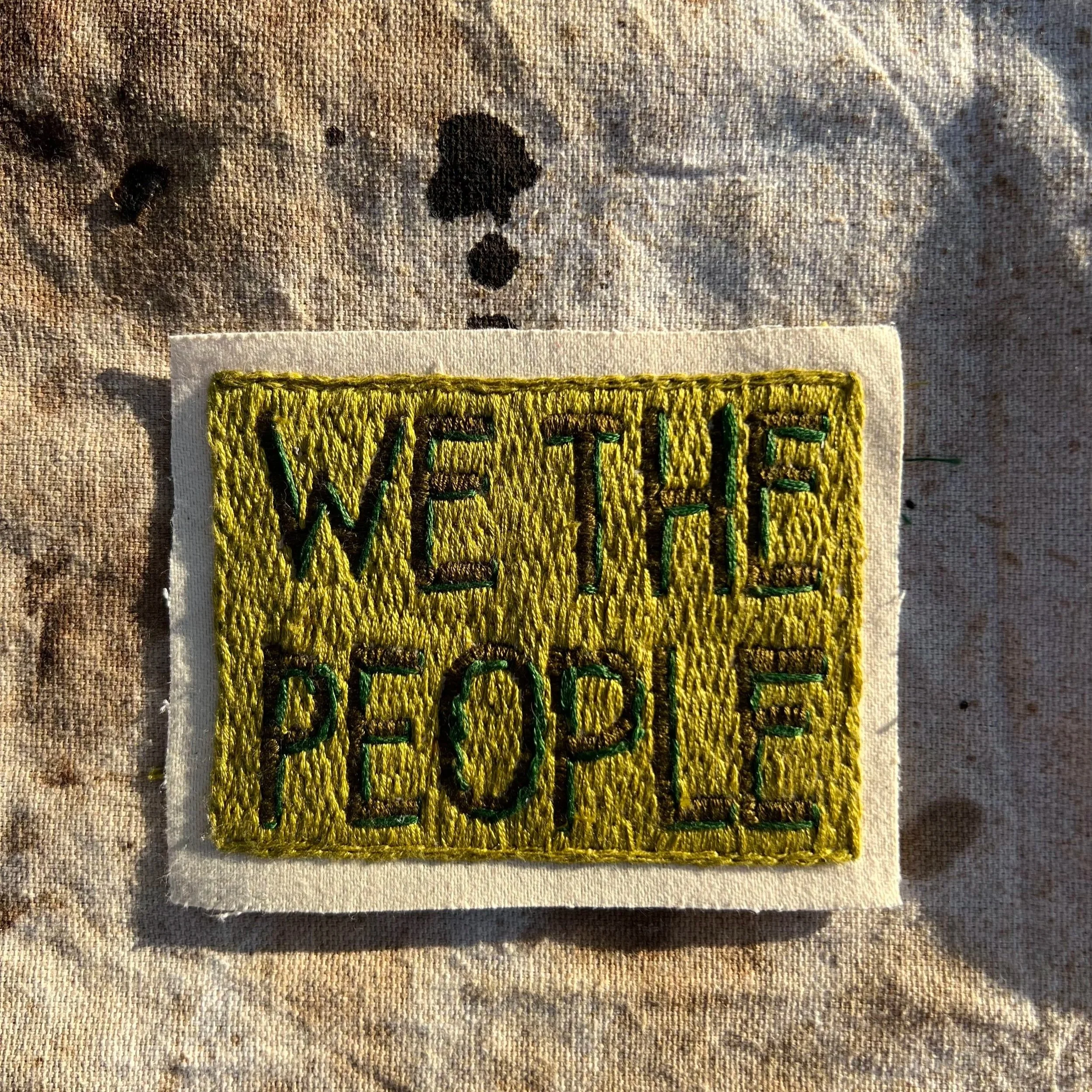 We The People hand-embroidered cotton patch made by artists from Mood Swing in California.