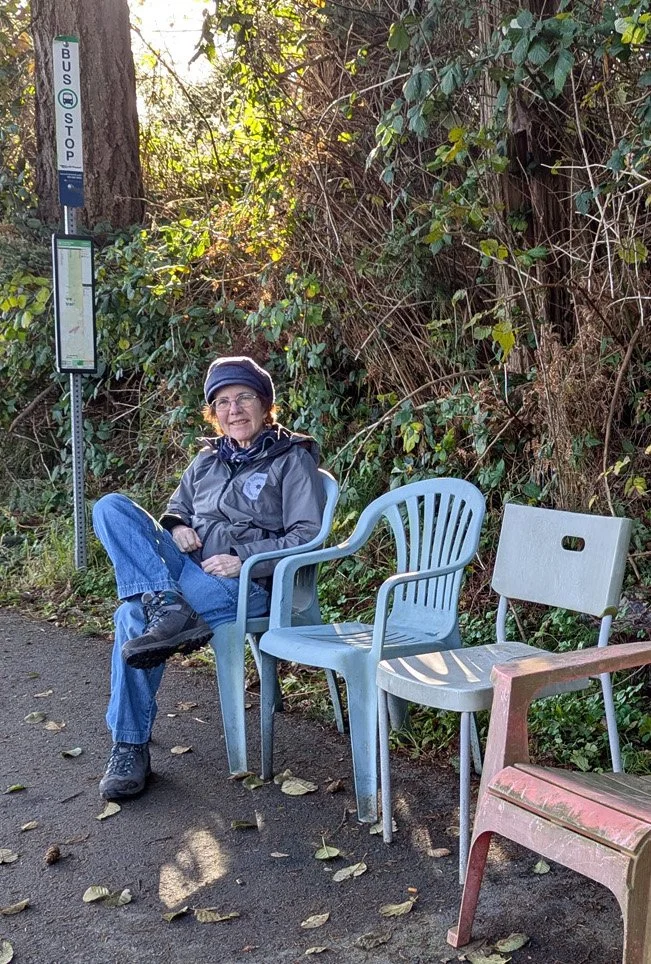 Donna McMahon sitting at a bus stop