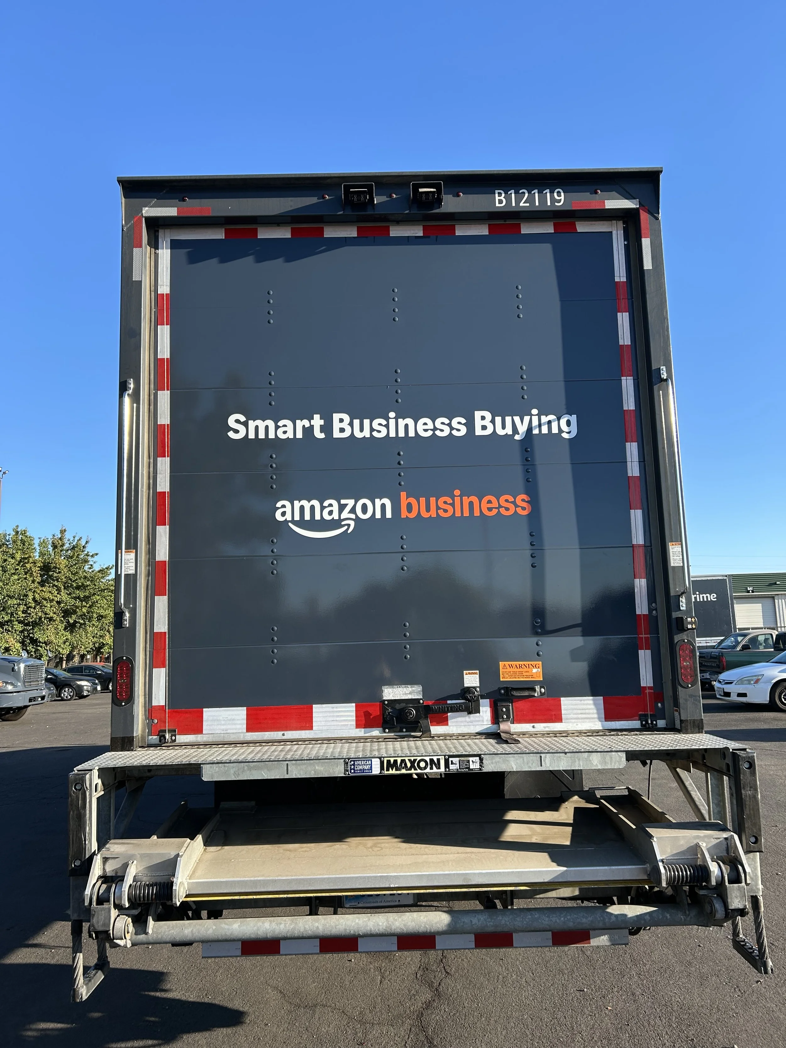 The back of a truck with a sign that reads "Smart Business Buying" and "Amazon business"