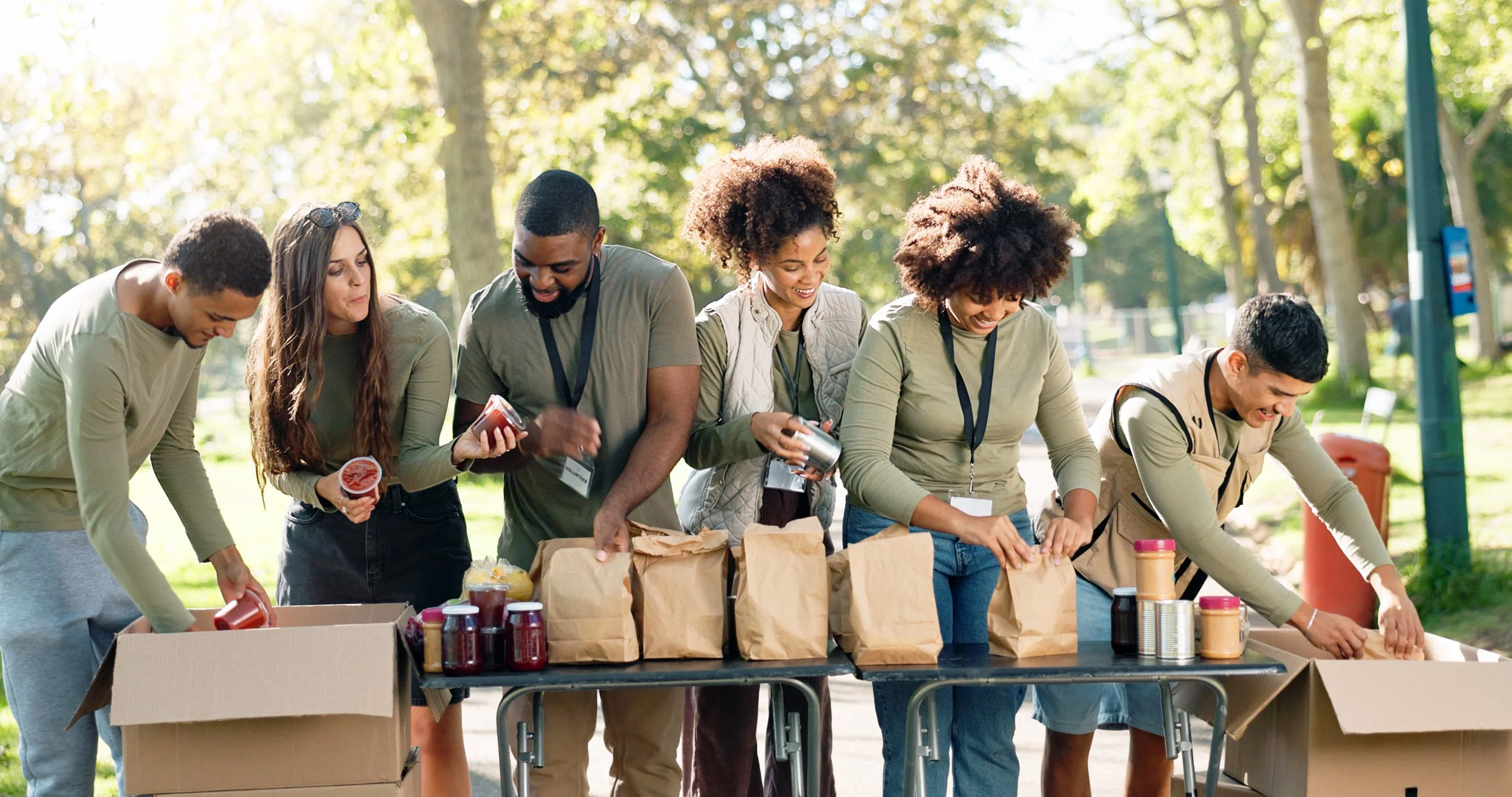 people volunteering pack food bank