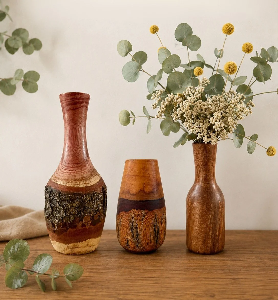 Handcrafted sustainable wood vases by Wildflower Fusion.