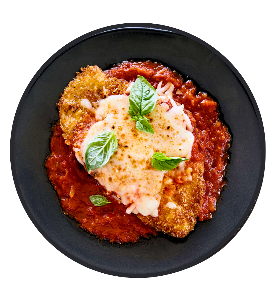 A savory meat pie with a flaky crust, filled with beef, vegetables, and gravy, with a sprig of rosemary on top. Radlett Fish & Chips, Grill