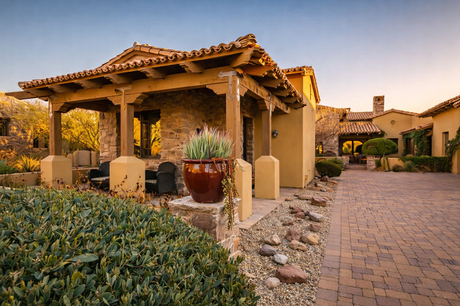 Modern interior living room with marble flooring, abstract chairs around a glass coffee table, a large potted plant, and a sitting area with a curved sofa near glass walls with curtains.