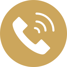 Icon of a white telephone receiver with signal waves on a gold circular background.