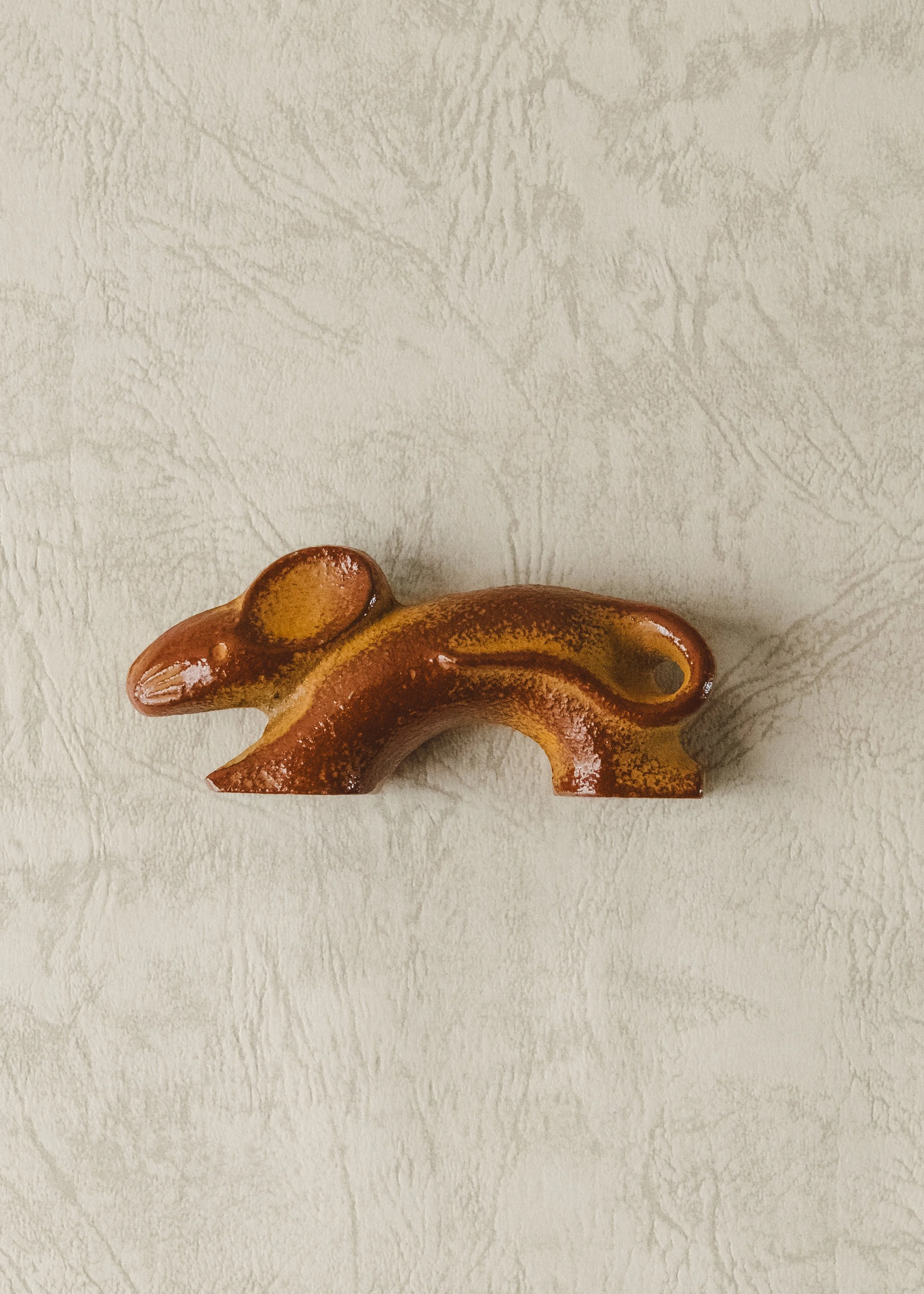 Silent desktop sculpture: iron rat figure for Zodiac prosperity. Hand-crafted Japanese ironware reflecting Zen-like simplicity and weight.