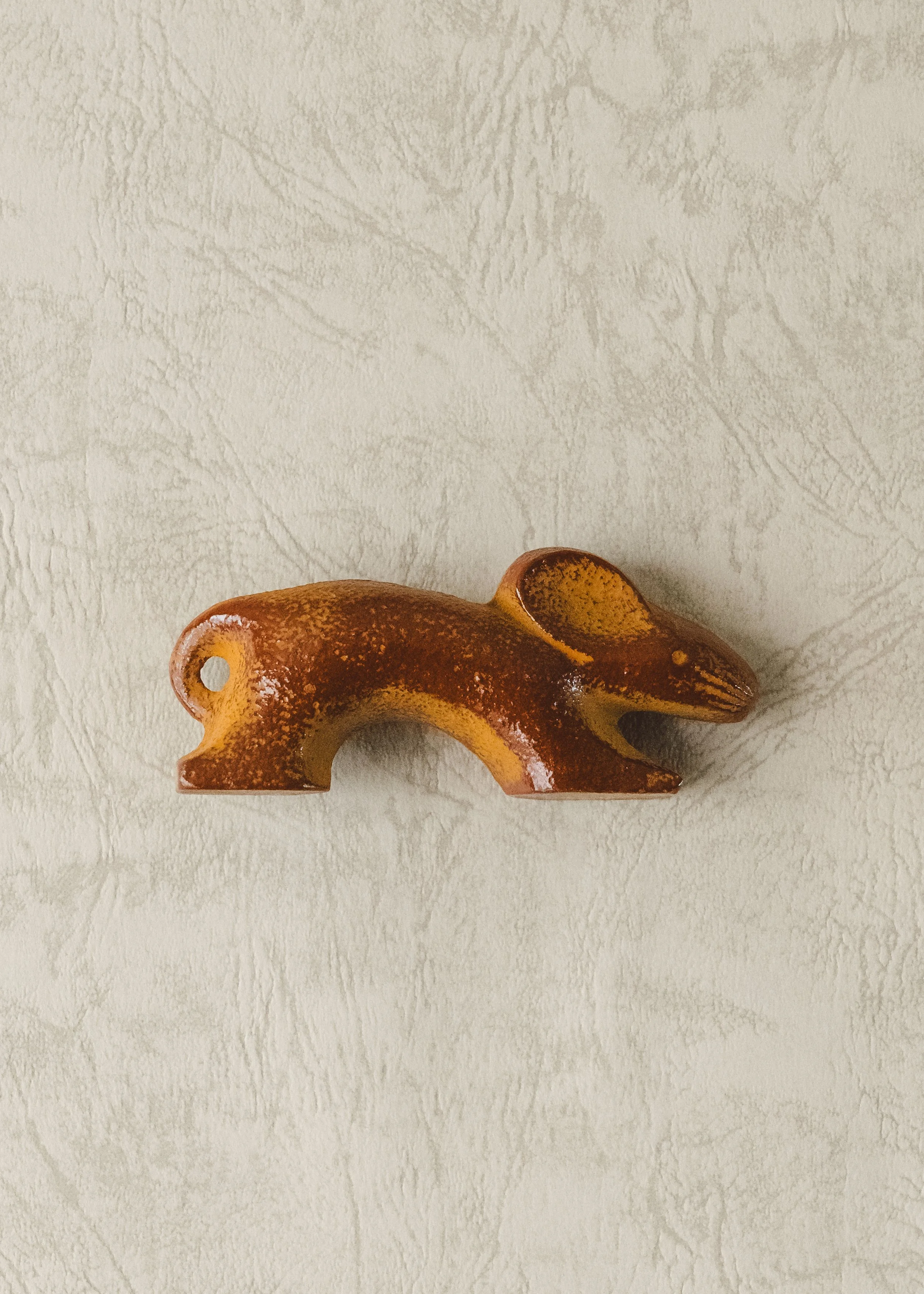 Silent desktop sculpture: iron rat figure for Zodiac prosperity. Hand-crafted Japanese ironware reflecting Zen-like simplicity and weight.