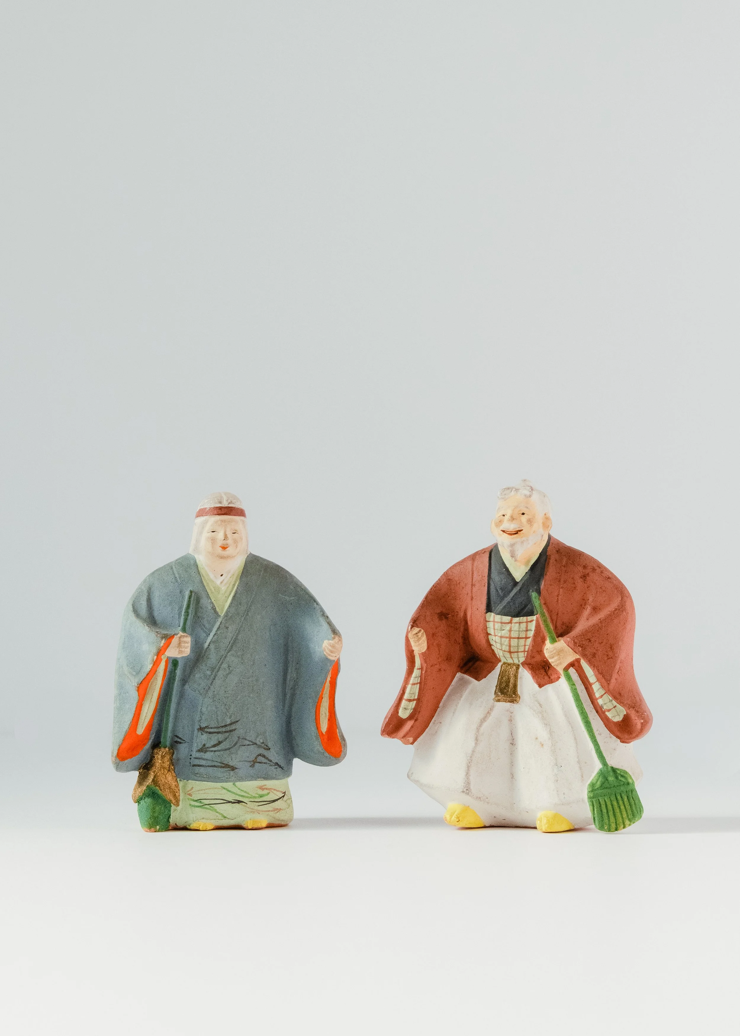 Pair of vintage Japanese tsuchi-ningyo clay dolls handcrafted mingei deities for home shrine decor