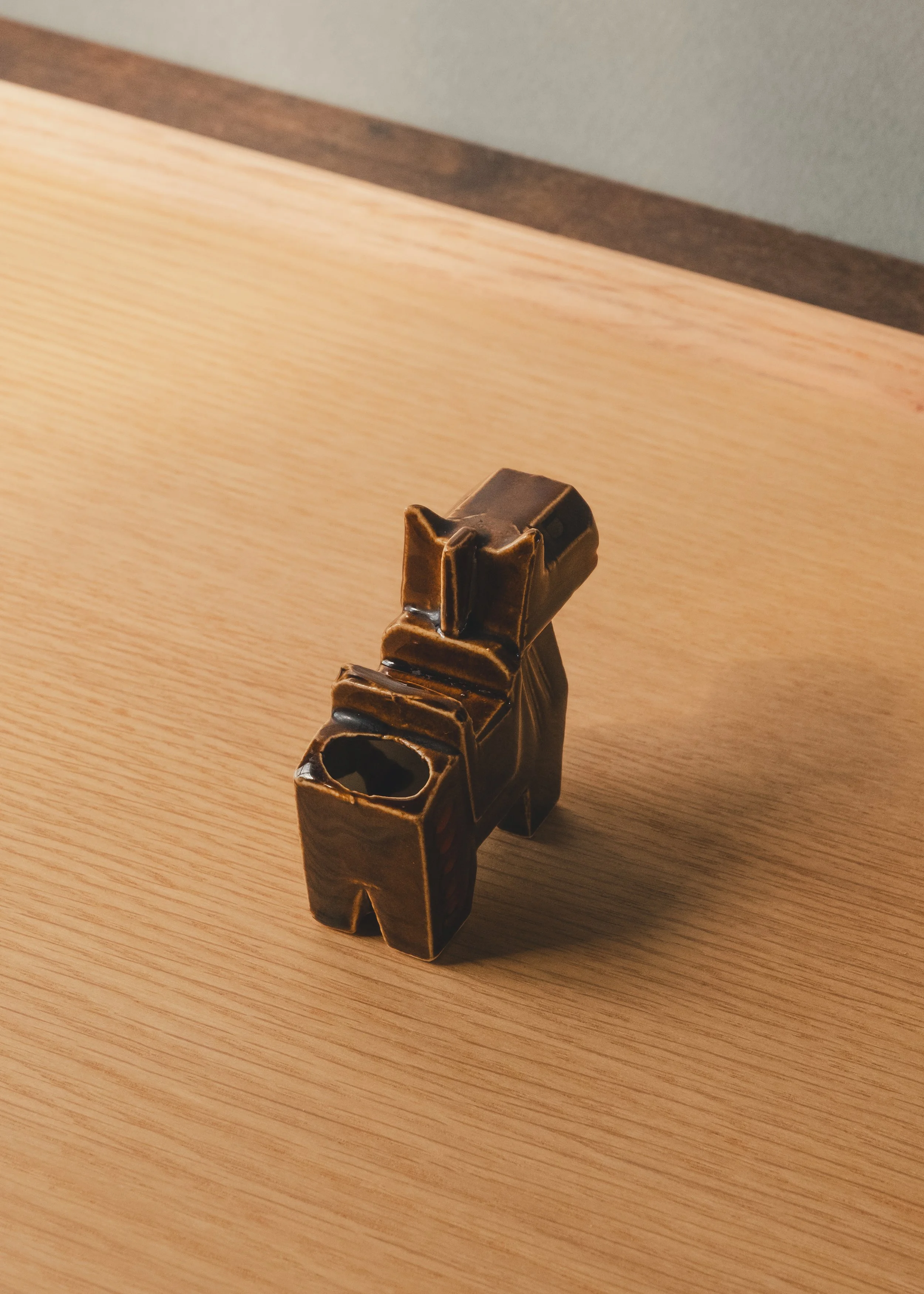 Hand-painted brown glazed ceramic horse sculpture functioning as a desk valet or toothpick stand.