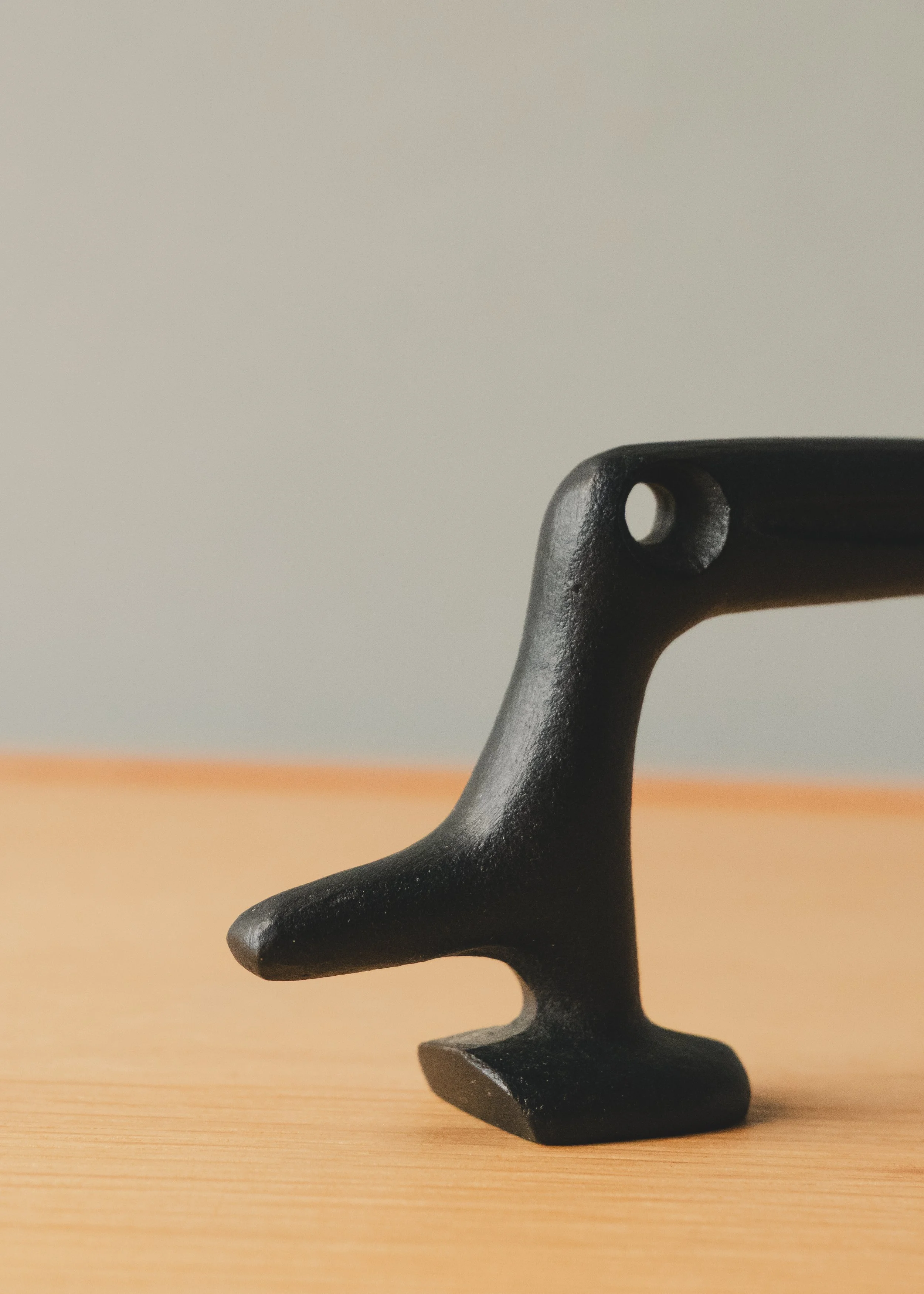 Detailed macro of the functional lever on a FERROUS RAVEN. Showcase of the industrial texture and "Patina of Utility" found in 1970s Japanese ironwork survivors.