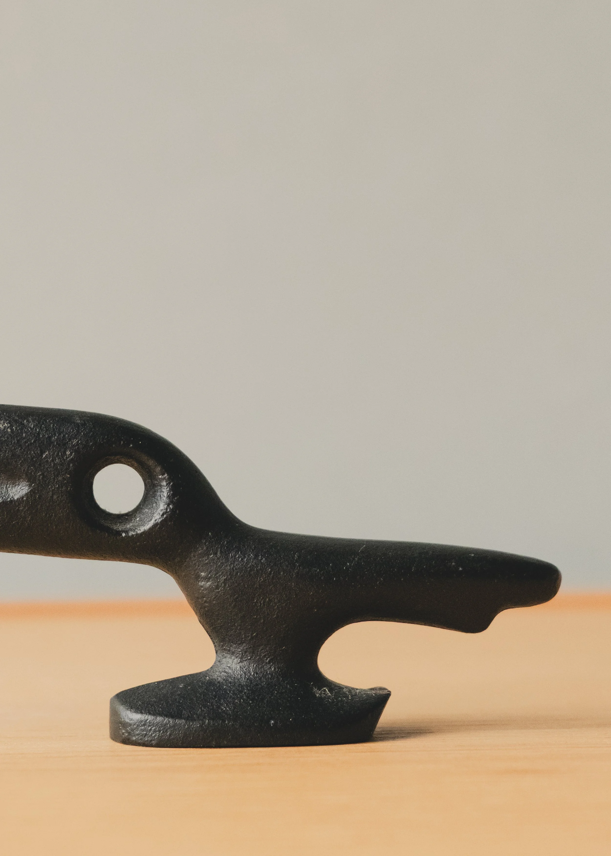 Detailed macro of the functional lever on a FERROUS RAVEN. Showcase of the industrial texture and "Patina of Utility" found in 1970s Japanese ironwork survivors.