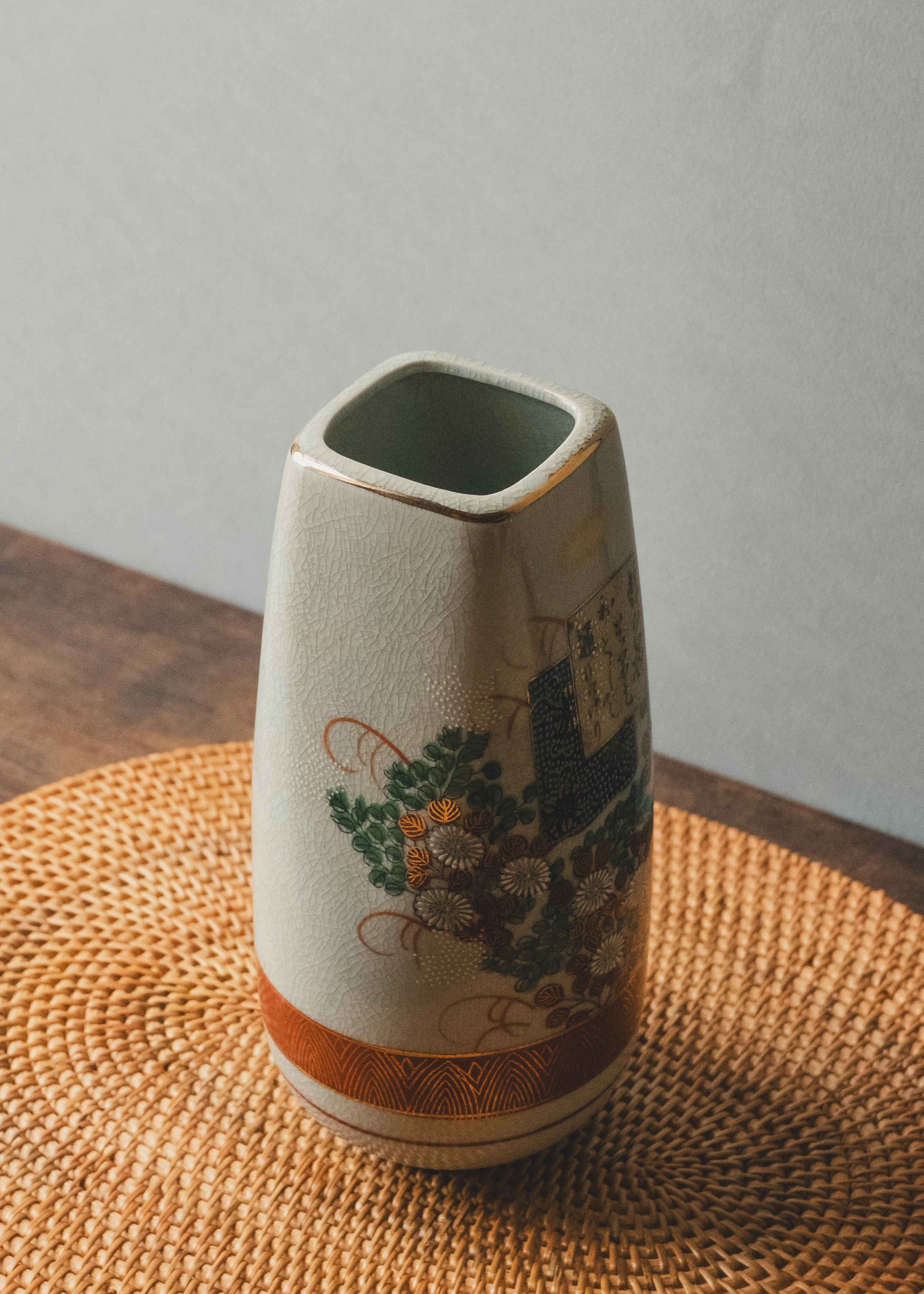 Exquisite vintage Japanese Kinrande ceramic flower vase with hand-painted gold waka poetry script and colorful floral patterns on white crackle glaze surface.