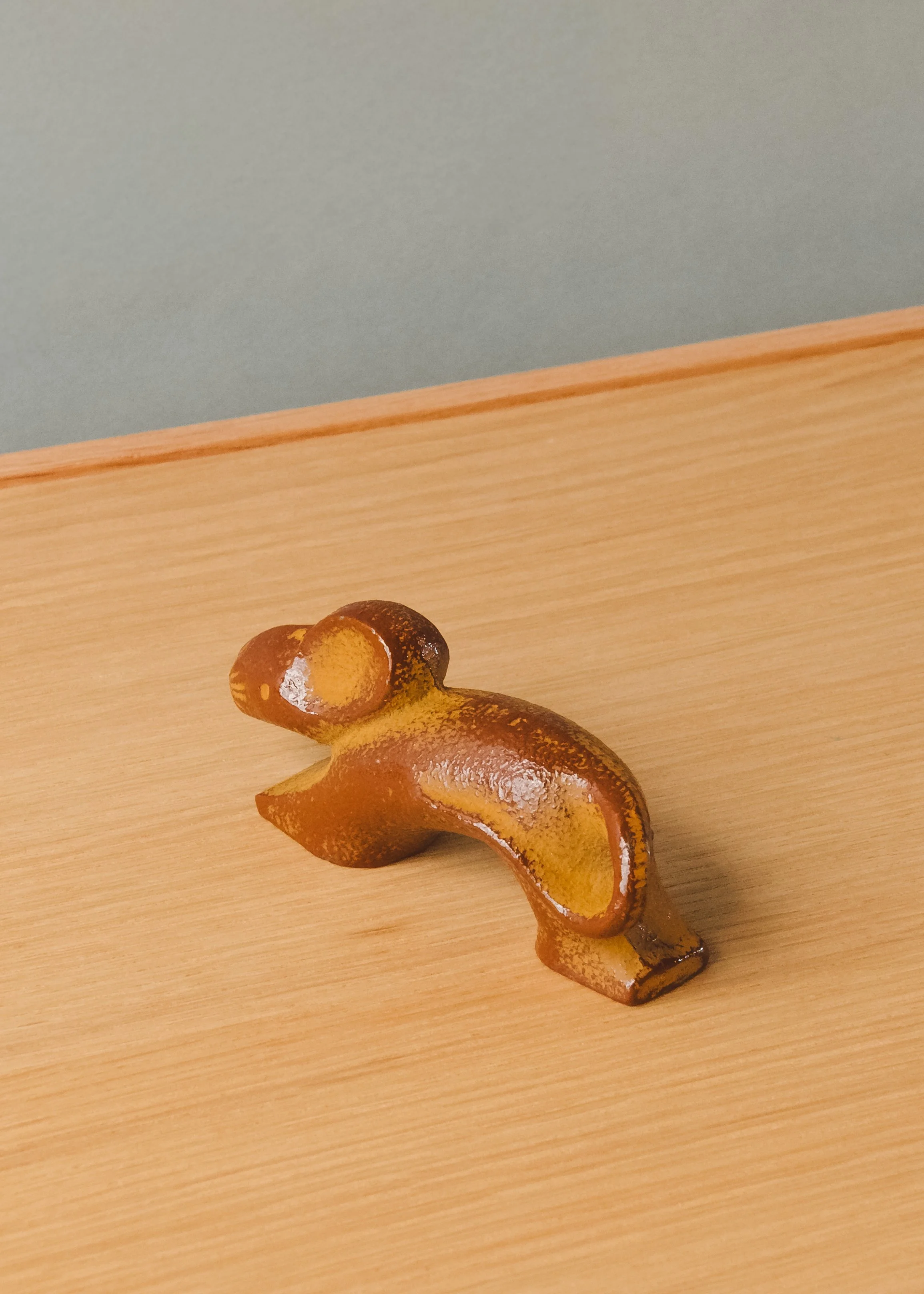 Nambu Tekki iron rat sculpture. Mid-century modernist silhouette forged from Japanese cast iron, ideal for minimalist desktop decor.