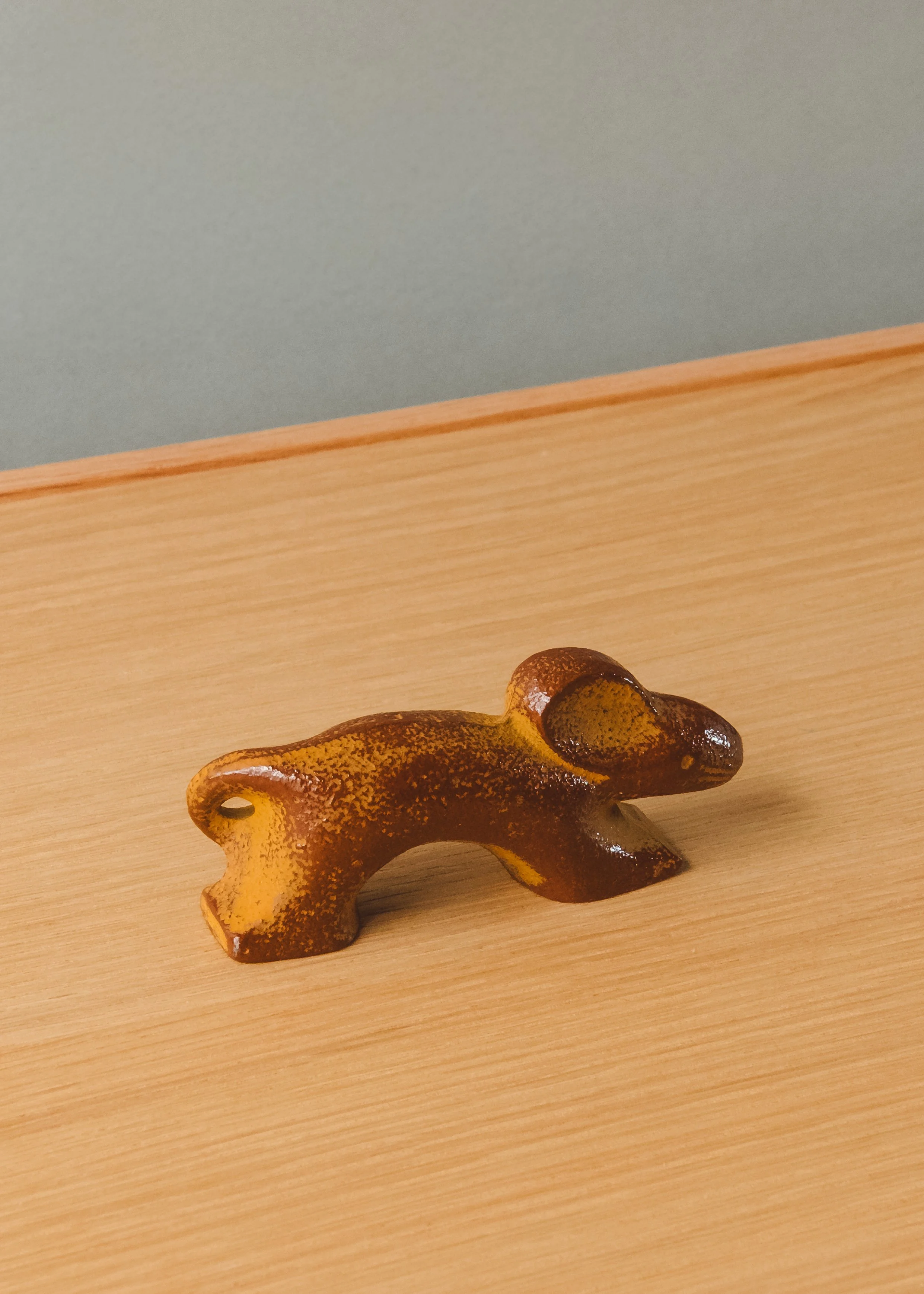 Nambu Tekki iron rat sculpture. Mid-century modernist silhouette forged from Japanese cast iron, ideal for minimalist desktop decor.