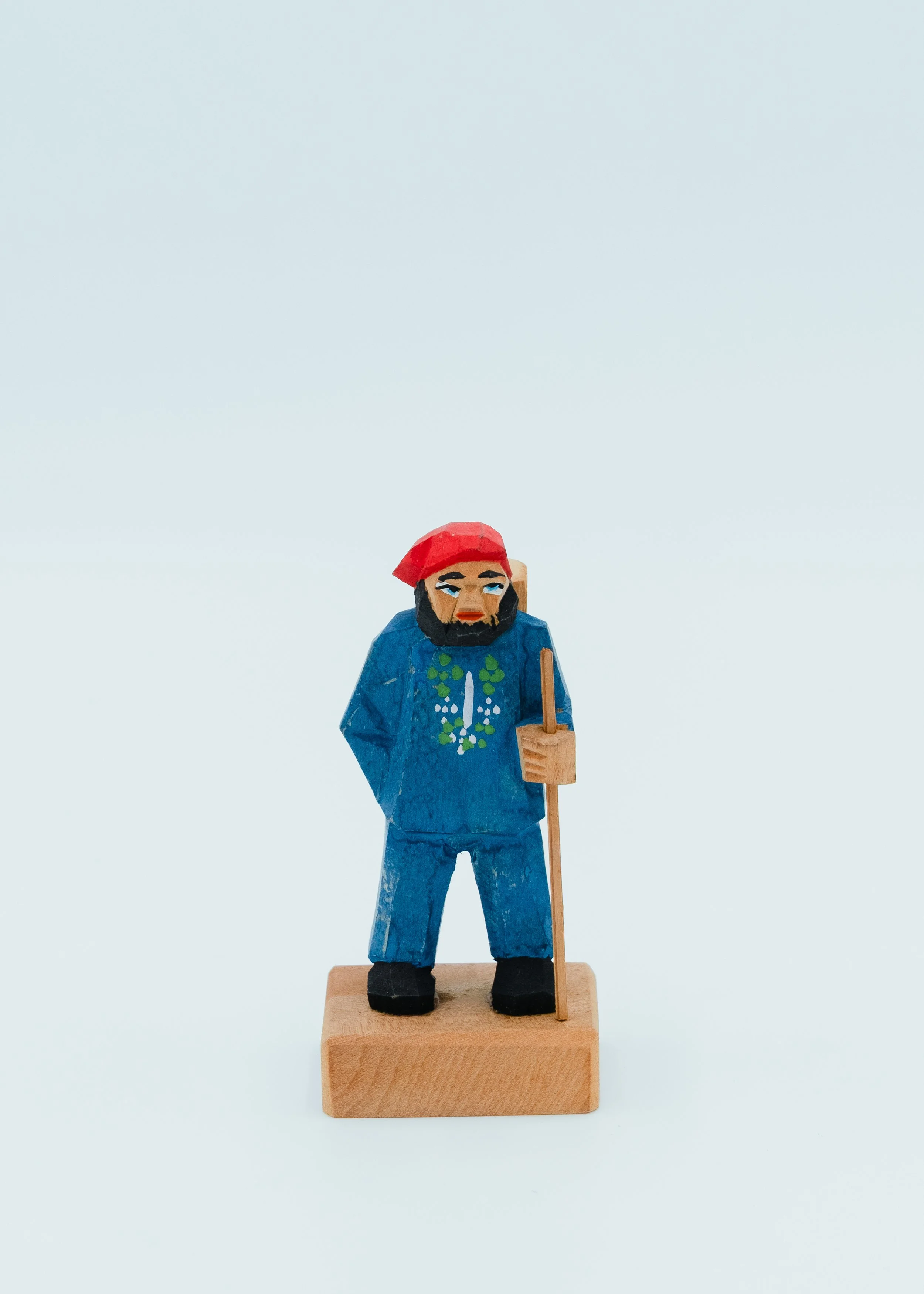 Blue painted vintage wooden Ainu doll wearing traditional clothes souvenir from Hokkaido Japan昭和retro