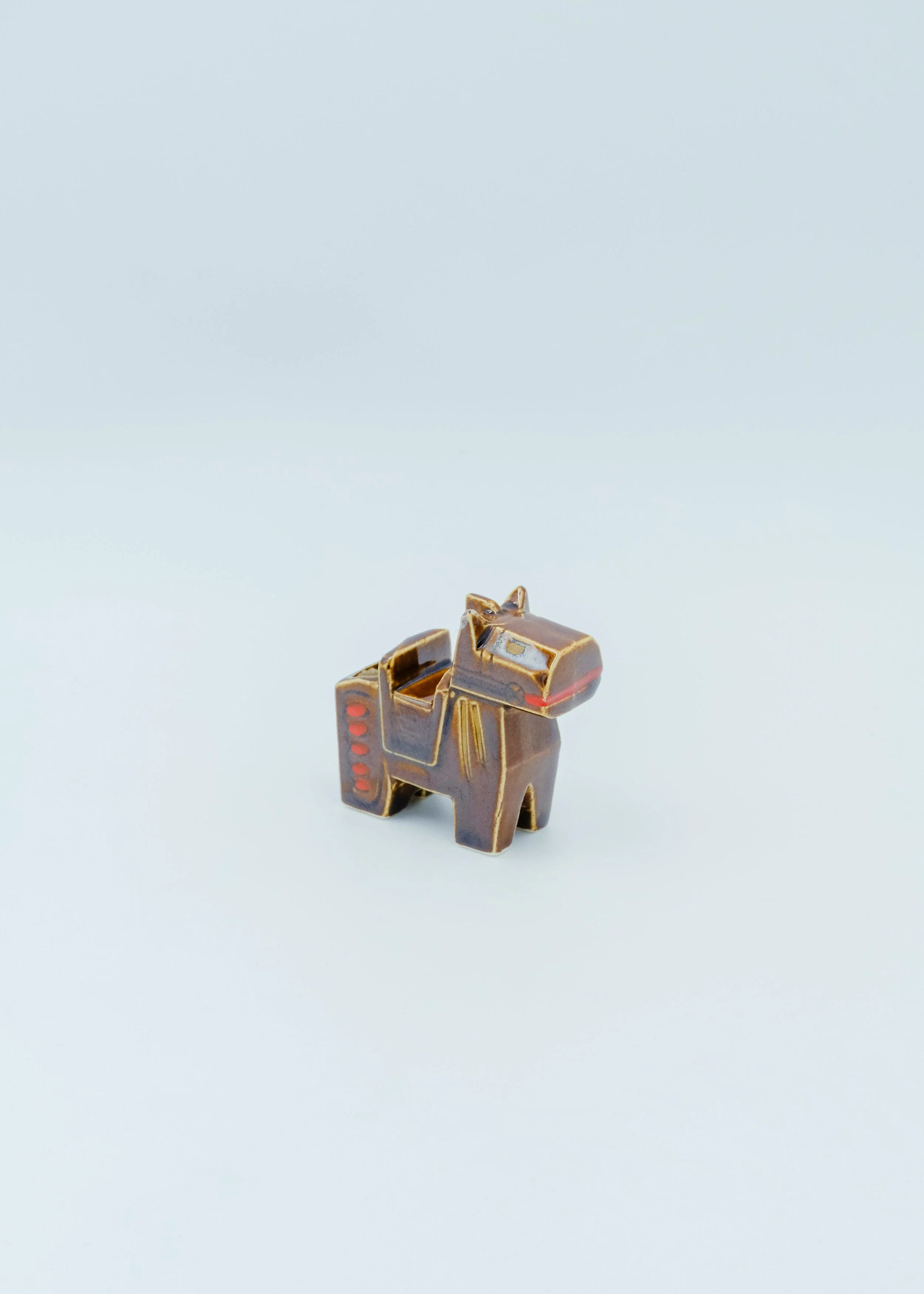 Minimalist mid-century japanese pottery horse objet d'art with hand-painted red accents.