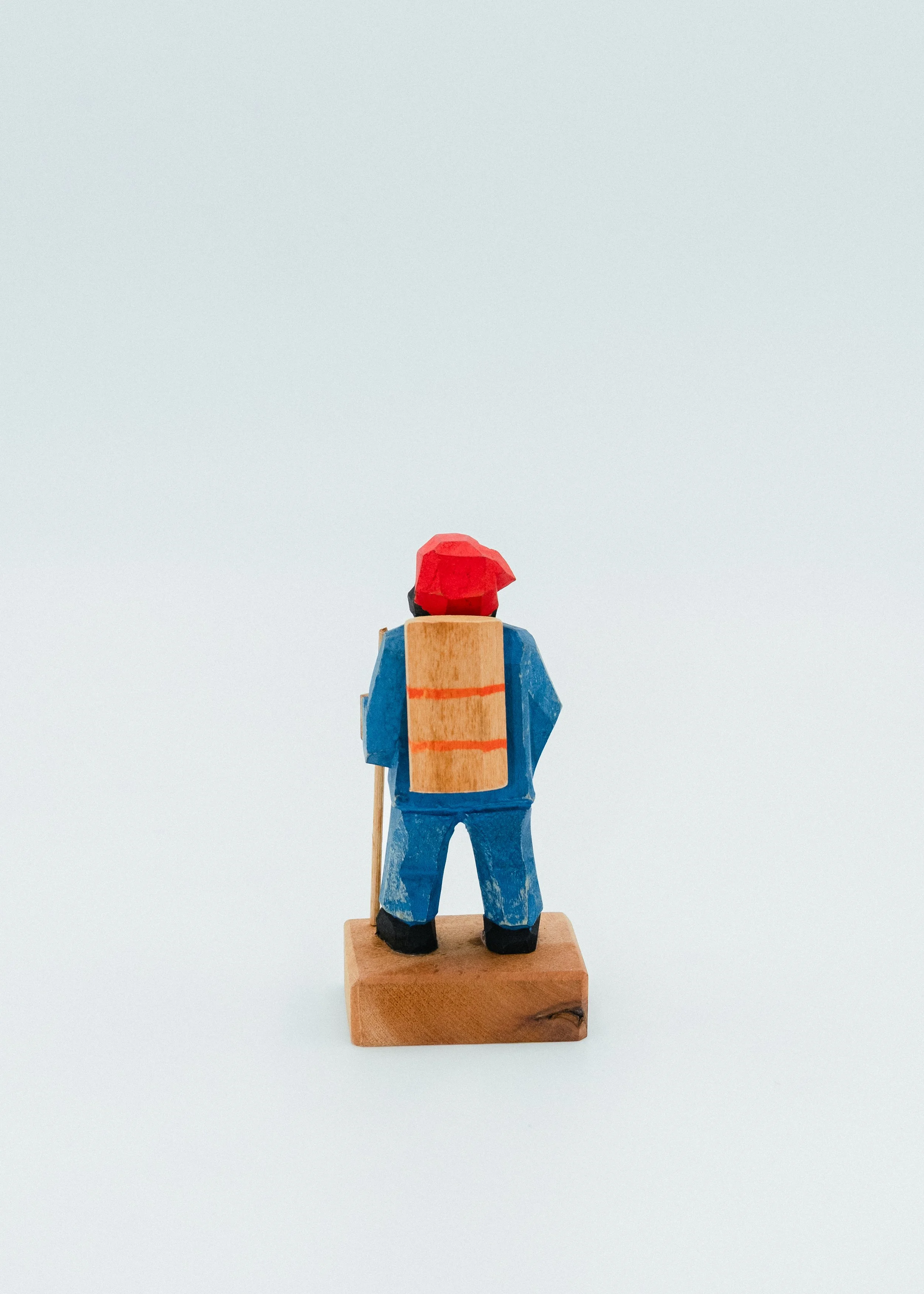 Rear view of hand carved wooden statues Ainu indigenous craft Hokkaido textured wood primitive sculpture