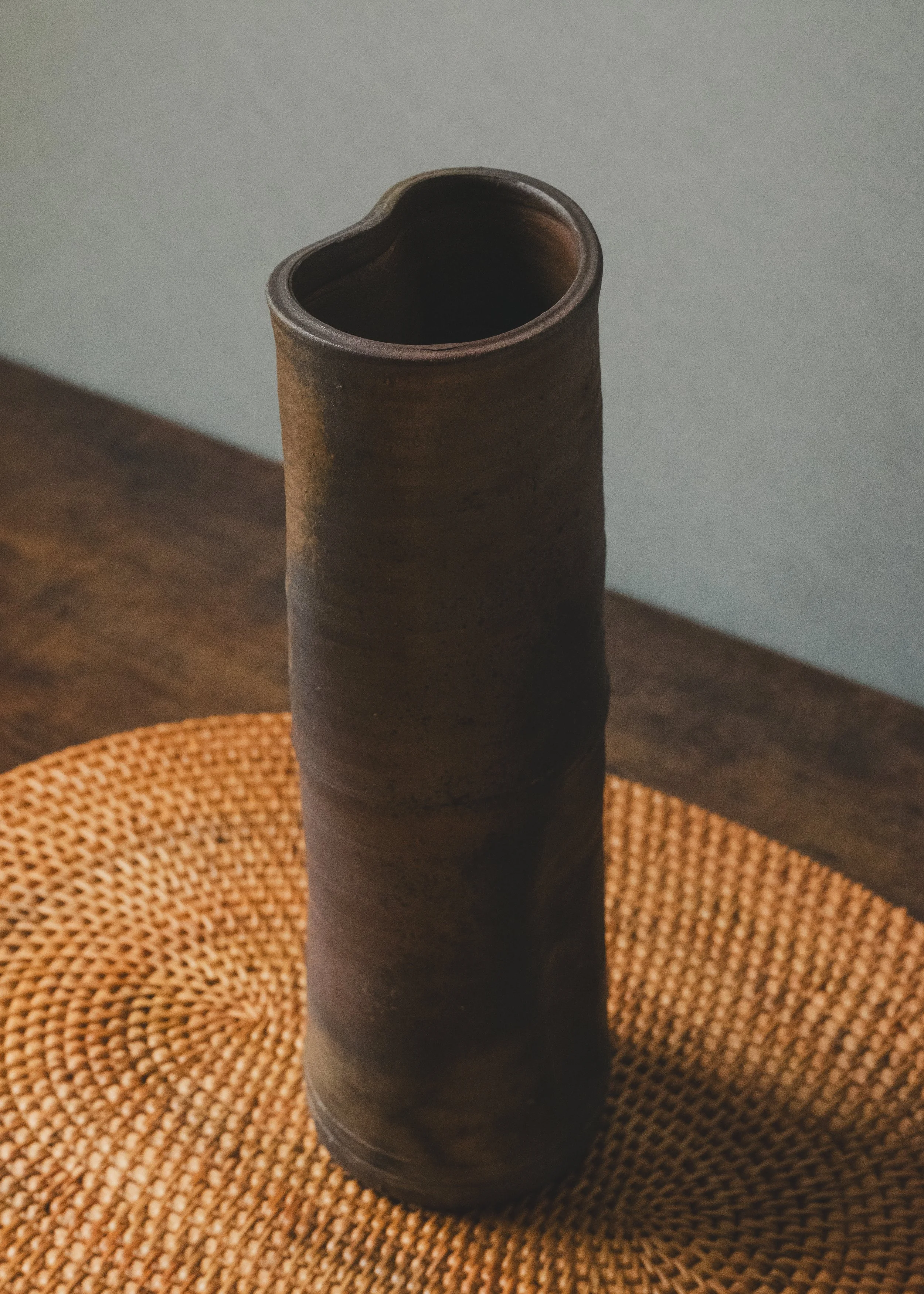 Unglazed high-fire Japanese stoneware cylinder vase from the Mid-Showa era, minimalist interior decor focus.