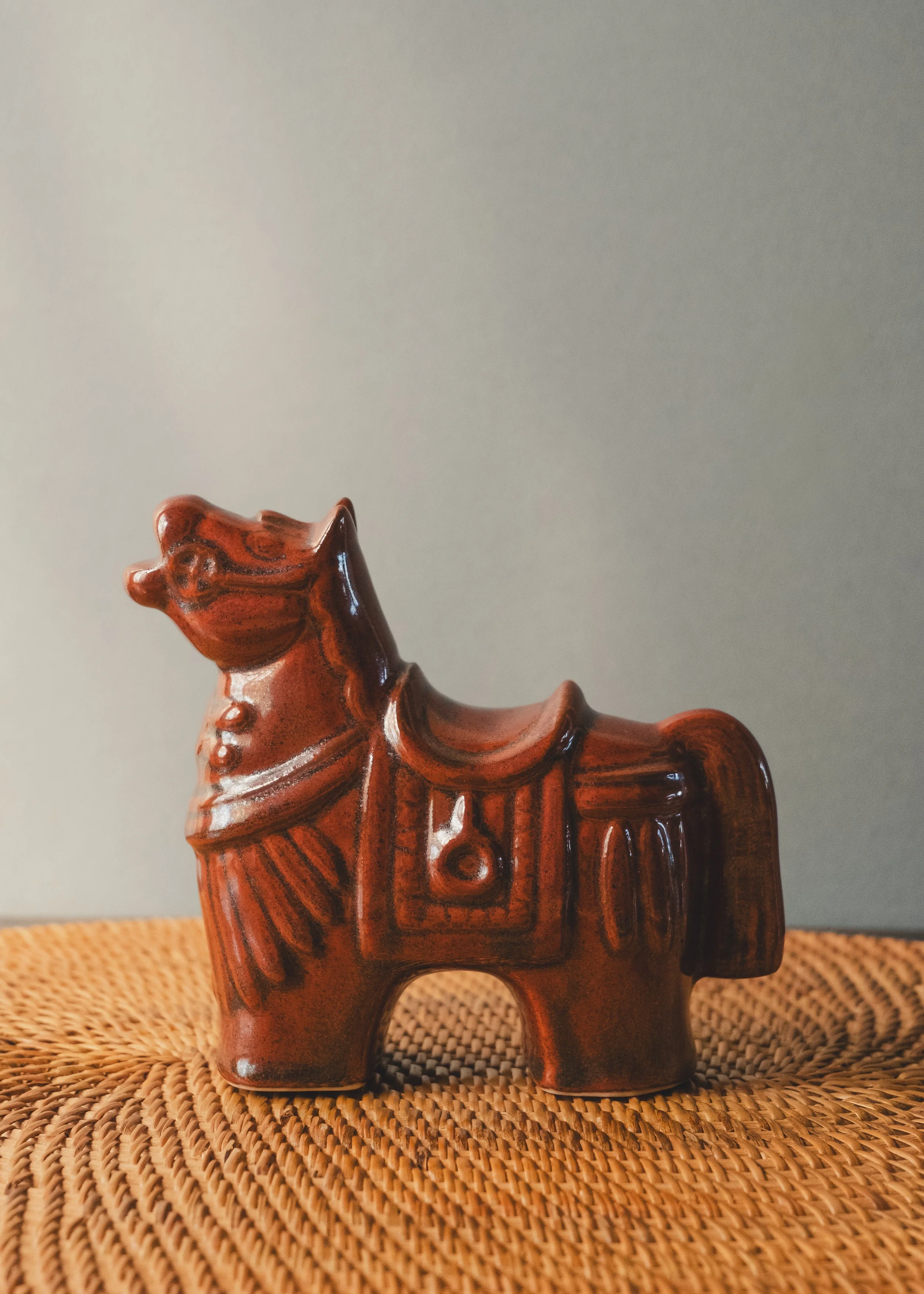 Vintage Japanese ceramic horse figurine in amber glaze, Shōwa era decorative folk craft.