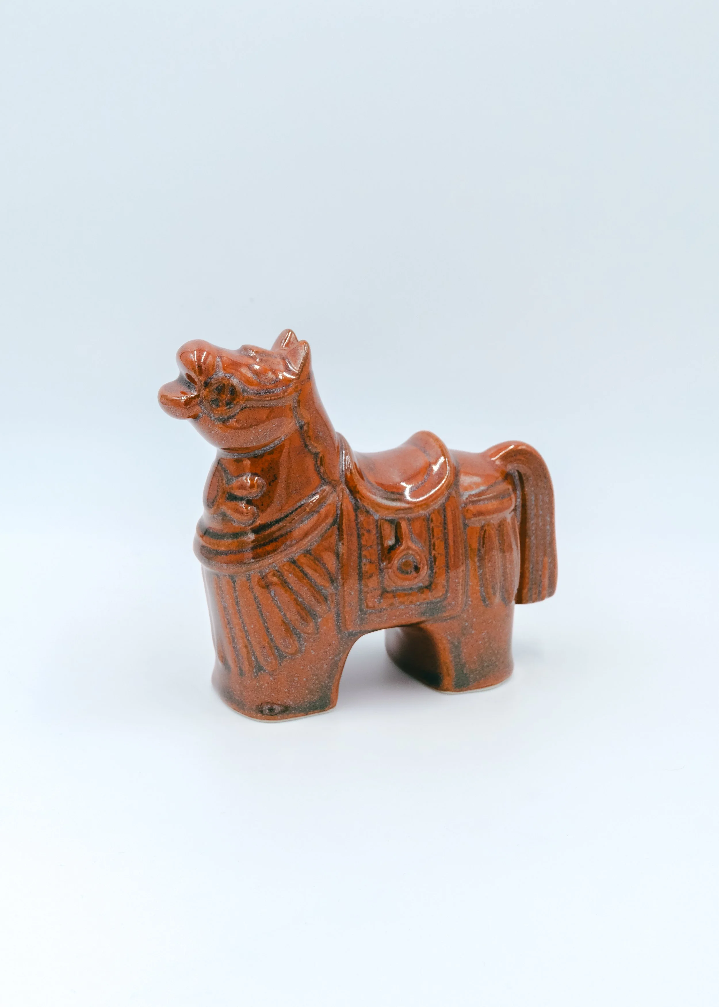 Vintage Japanese ceramic horse figurine in amber glaze, Shōwa era decorative folk craft.