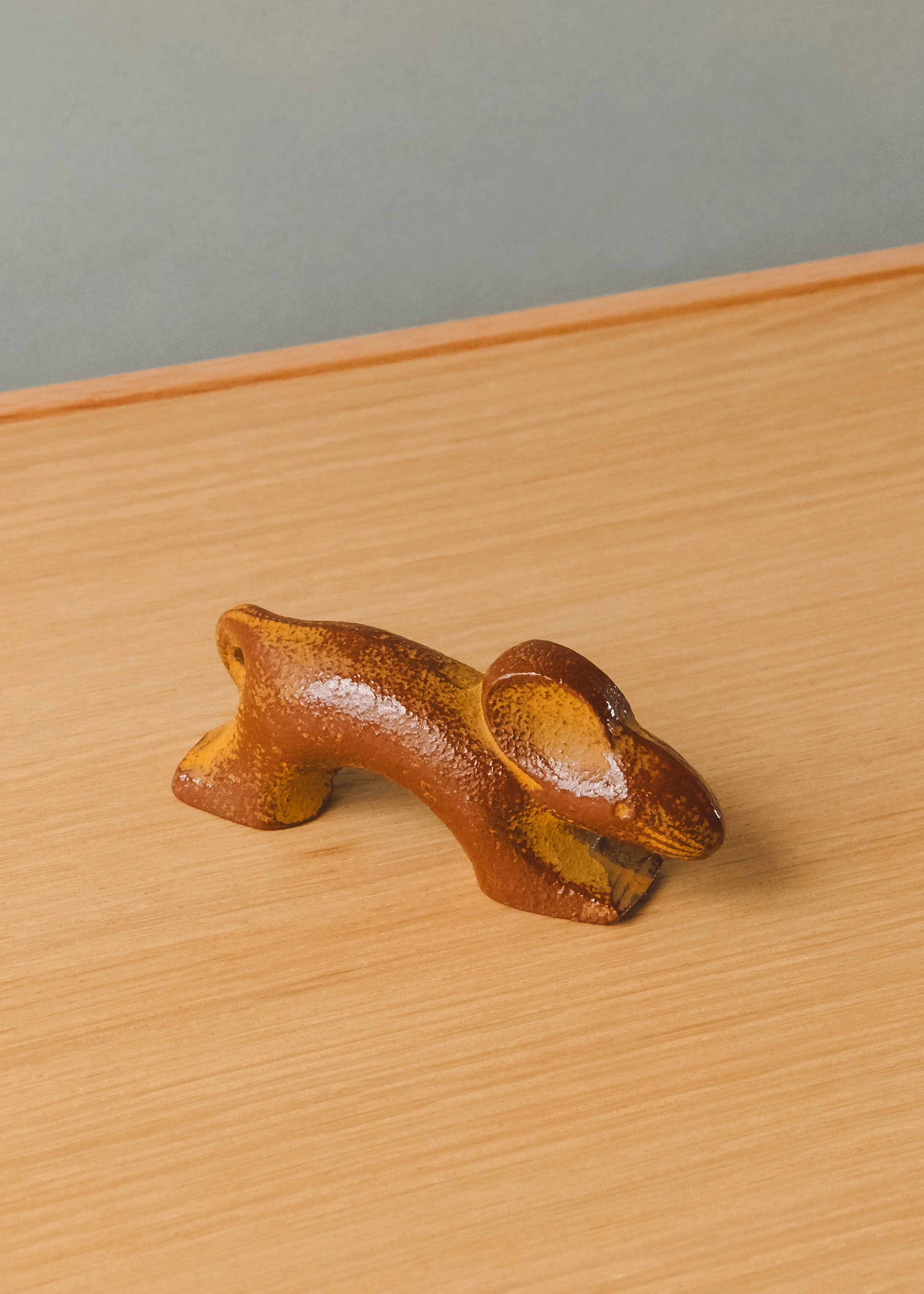 Nambu Tekki iron rat sculpture. Mid-century modernist silhouette forged from Japanese cast iron, ideal for minimalist desktop decor.