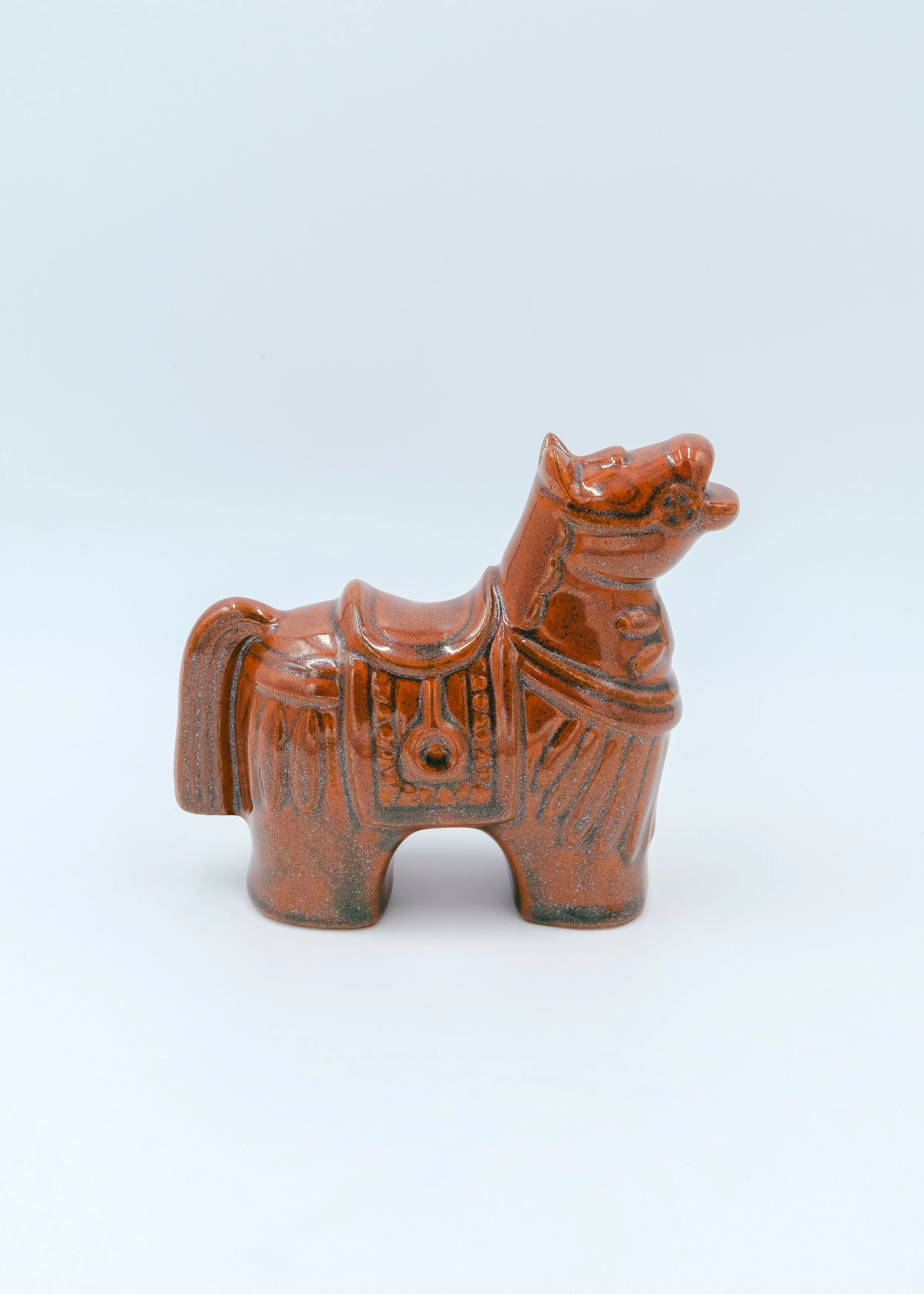 Vintage Japanese ceramic horse figurine in amber glaze, Shōwa era decorative folk craft.