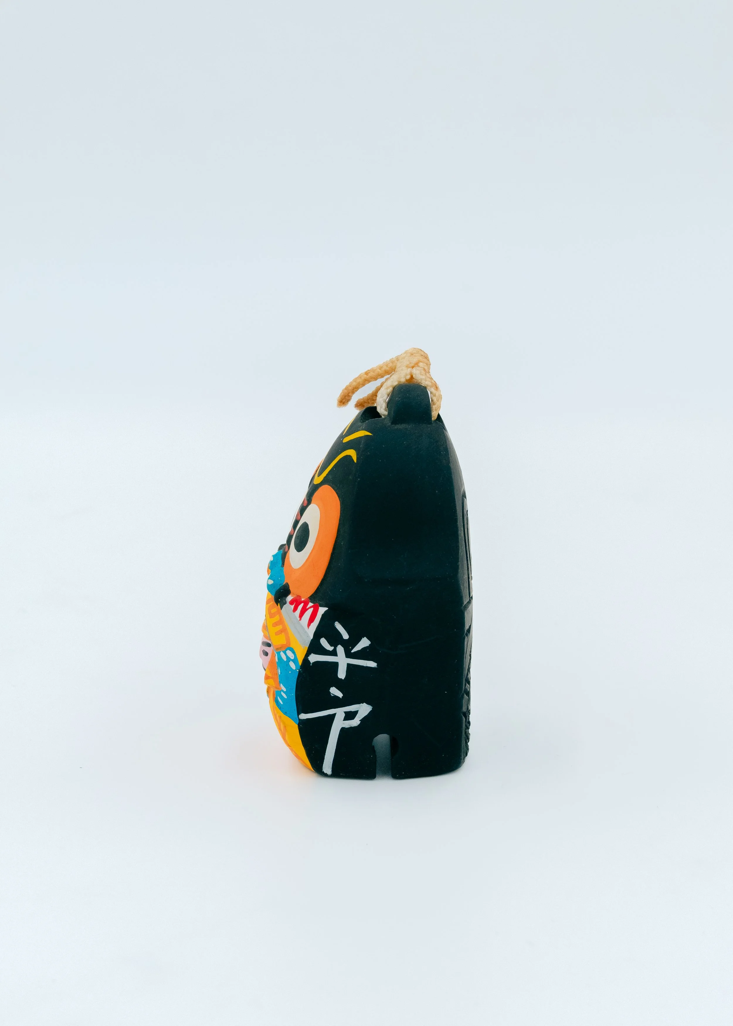 Rear view of the Hirado Sentinel amulet, displaying hand-carved kanji characters "Hirado" signifying its authentic origin in the Nagasaki islands.