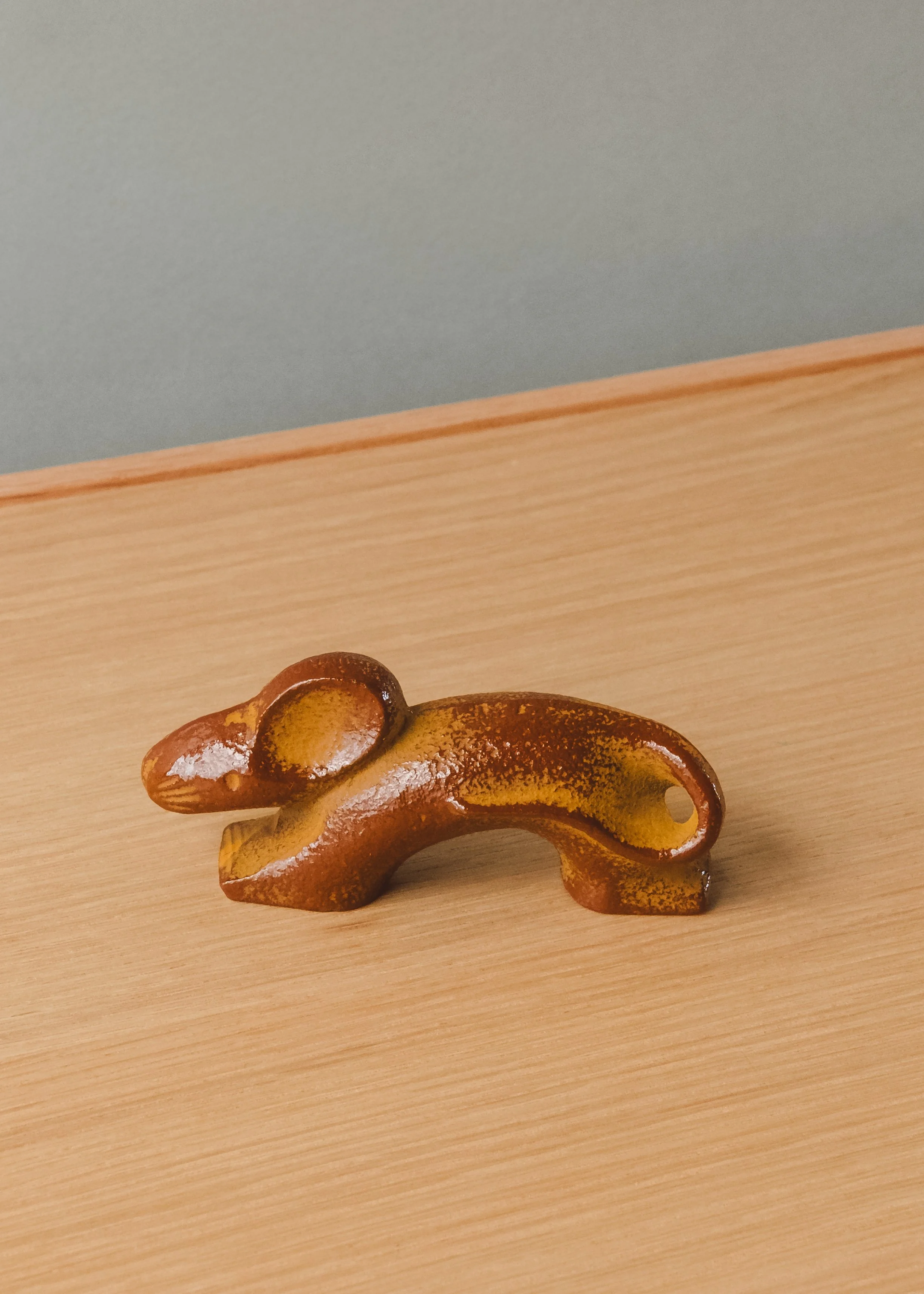 Nambu Tekki iron rat sculpture. Mid-century modernist silhouette forged from Japanese cast iron, ideal for minimalist desktop decor.