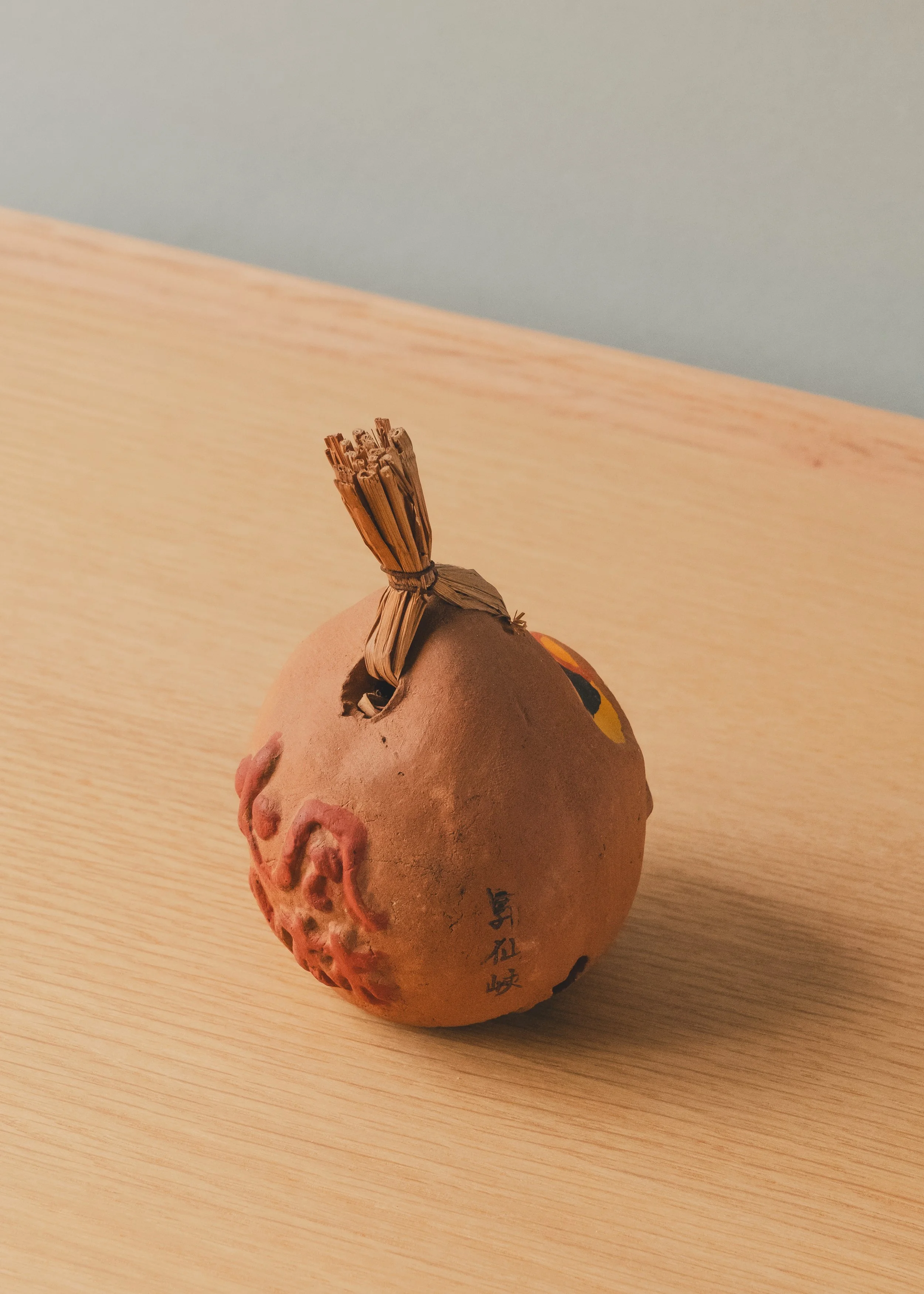 Close-up of the Shosenkyo spiritual site origin marking and hand-embossed kanji on the UNGLAZED TALISMAN 1970. Authentic provincial archival specimen.