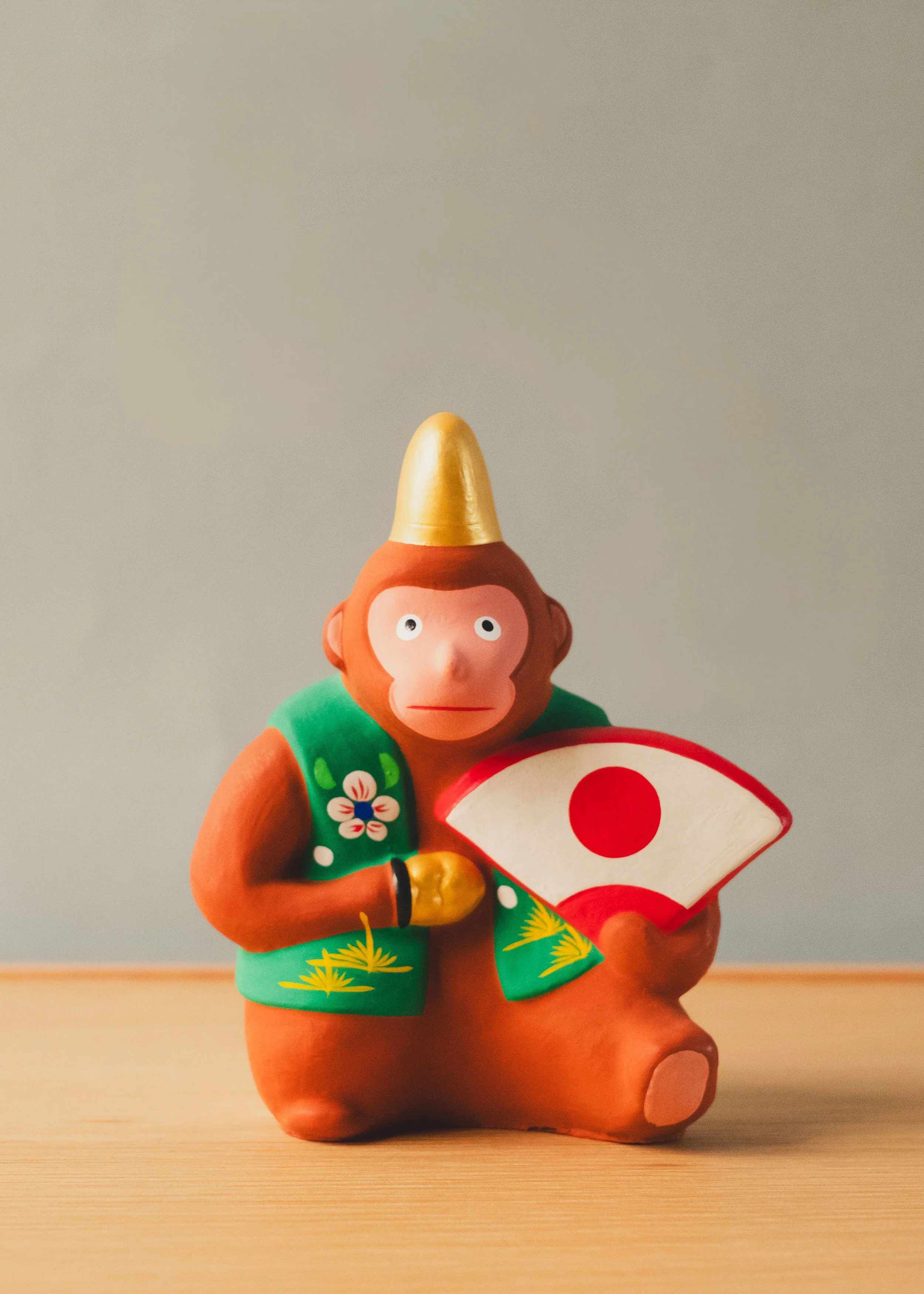 Centered view of the Hanamaki Herald 1974. A vivid clay guardian from Japan, representing prosperity and an anchor of decisive intellect.