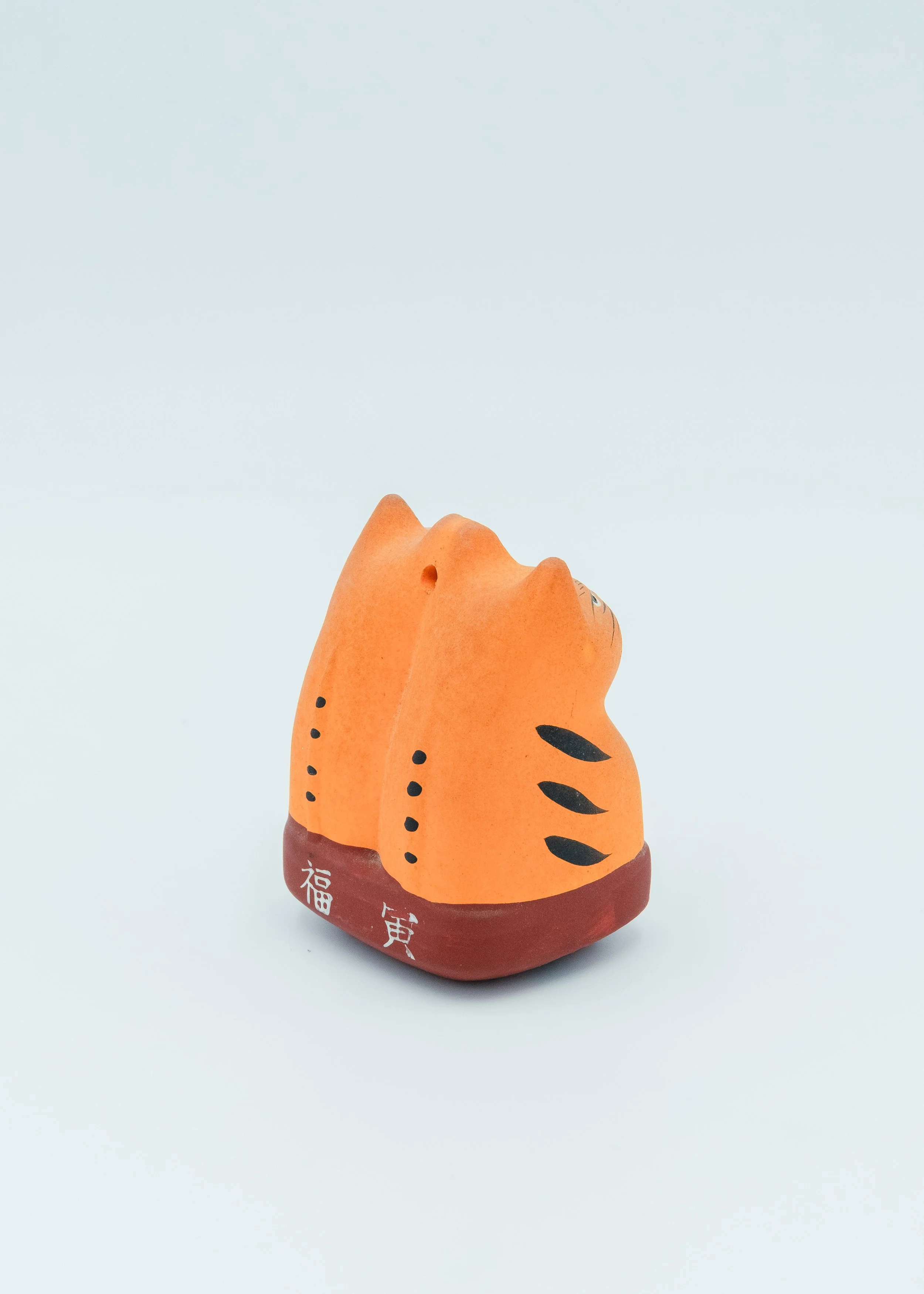 Back view of antique clay statue with Kurama Yama signature birthplace of Reiki spiritual amulet