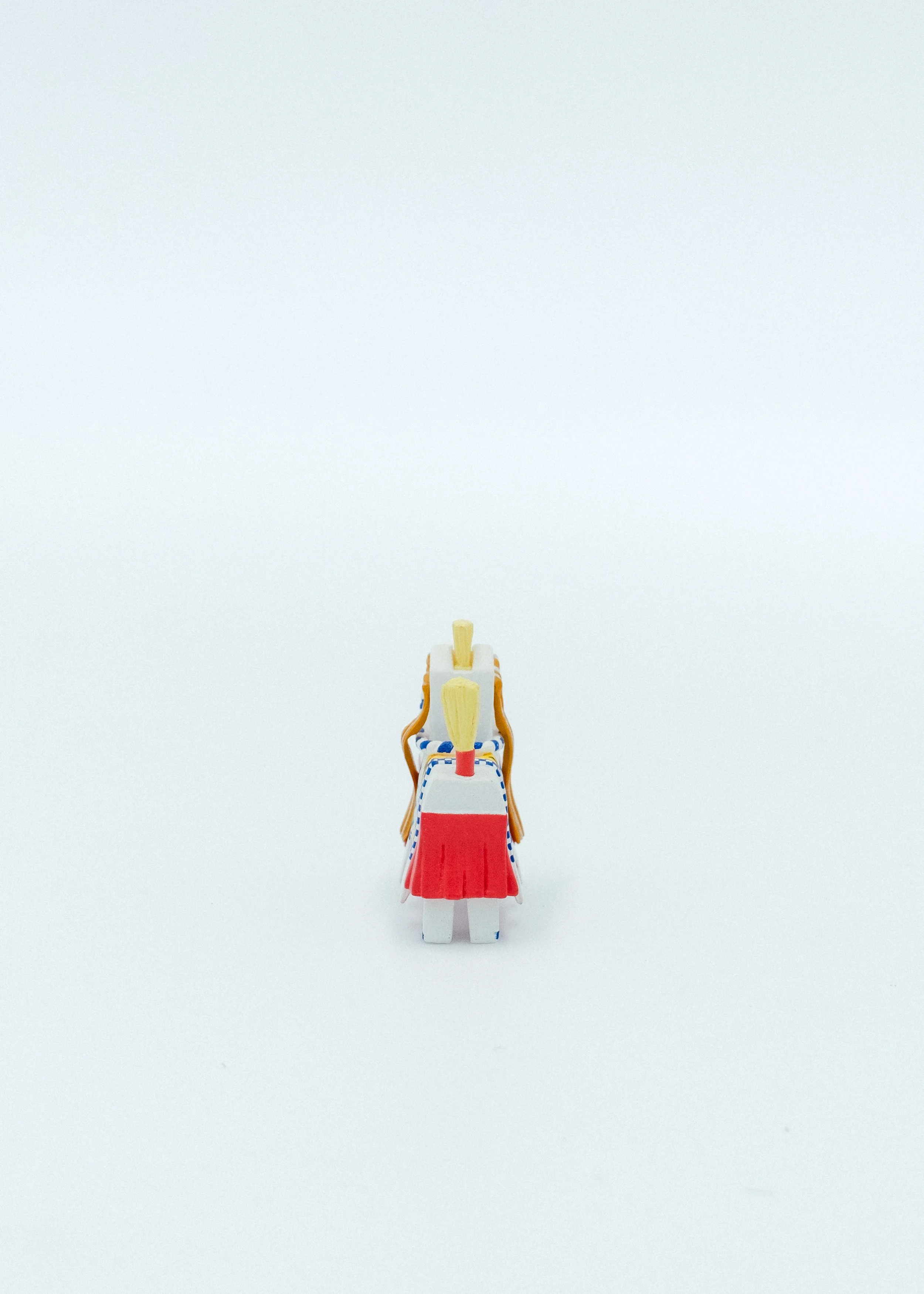 Back view of tiny wooden style horse sculpture Japanese lucky charm detailed hand painting