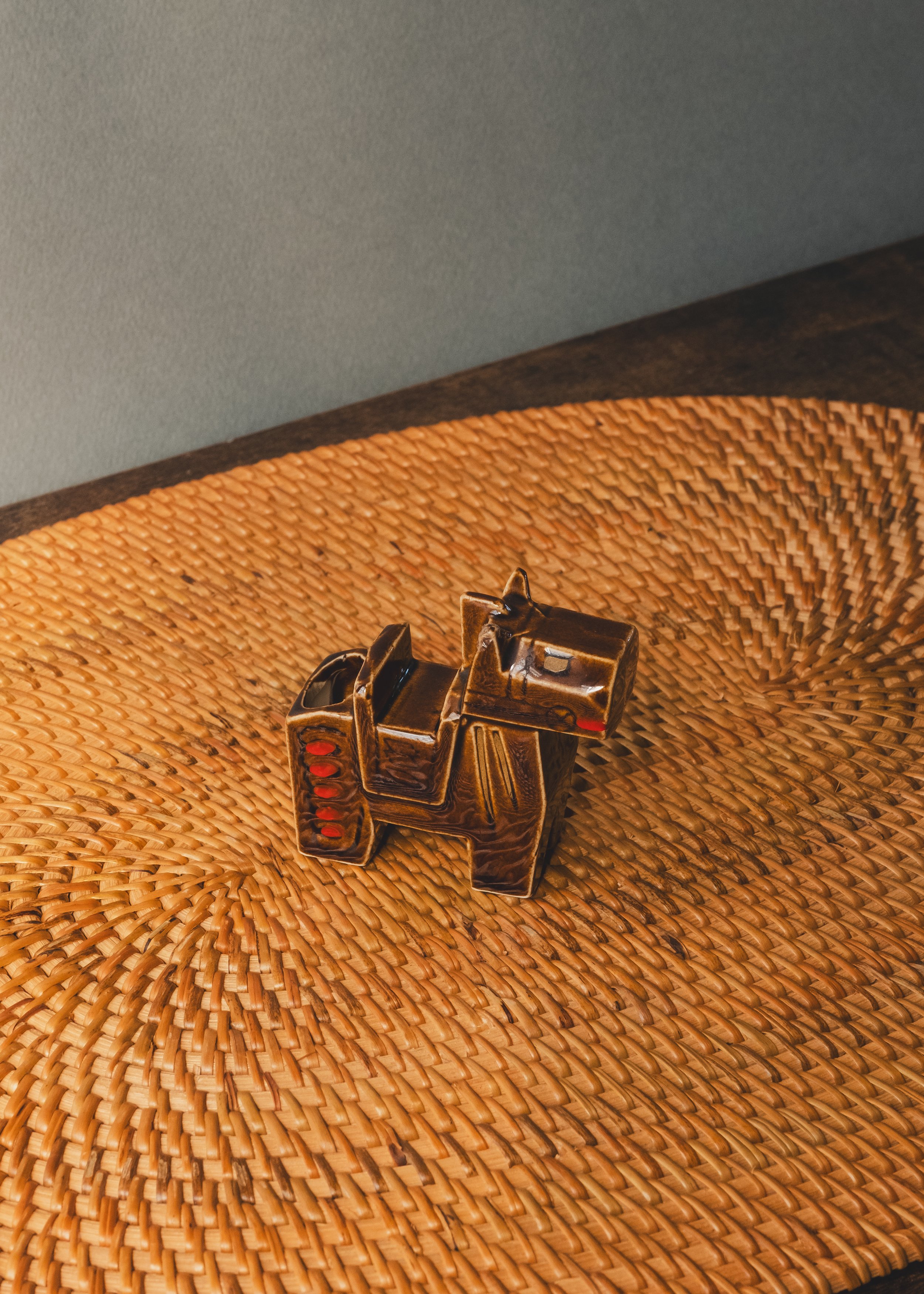 Vintage Japanese ceramic horse figurine with faceted polygon shape and amber glaze, 1960s Shōwa period.